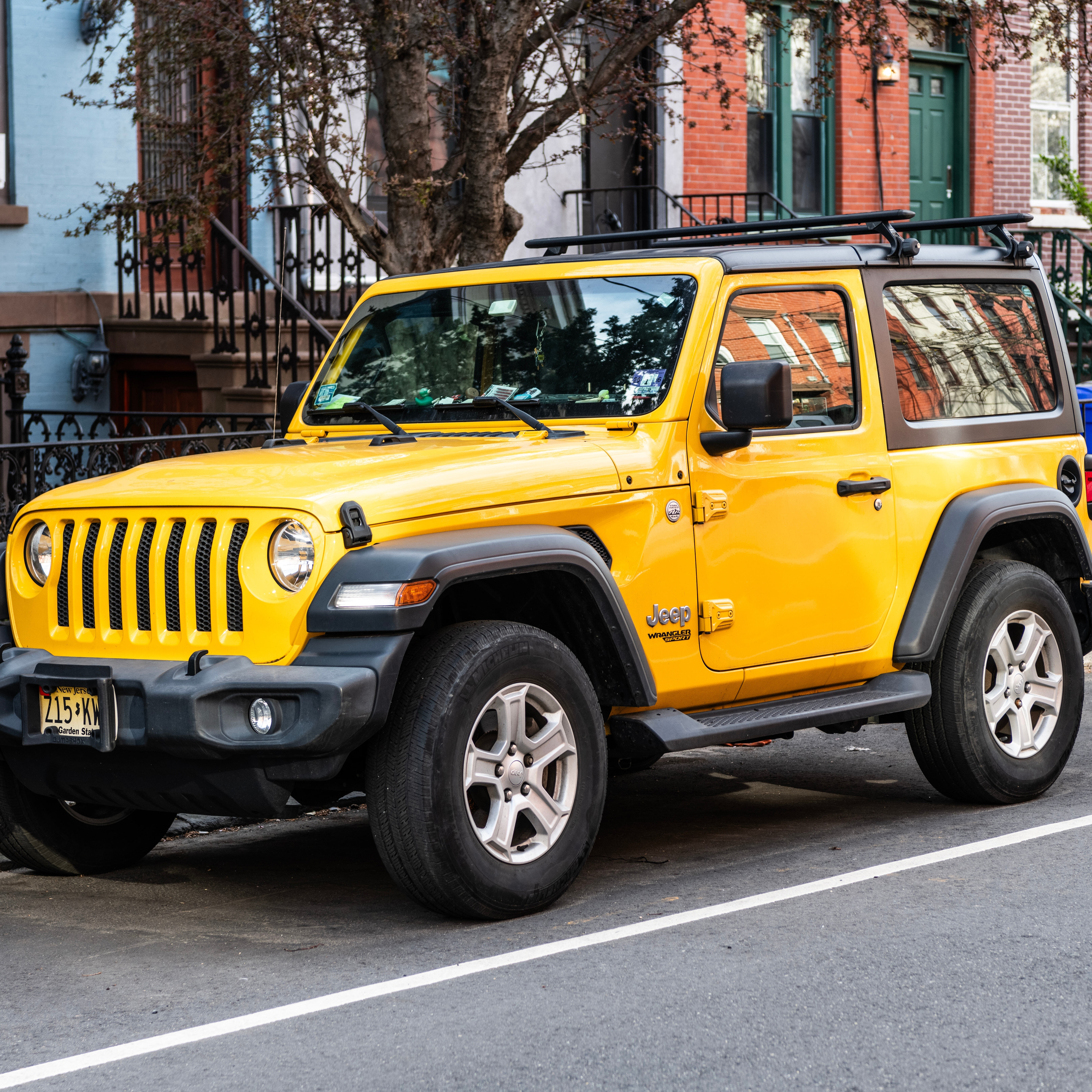 A Jeep parked outside of a home.