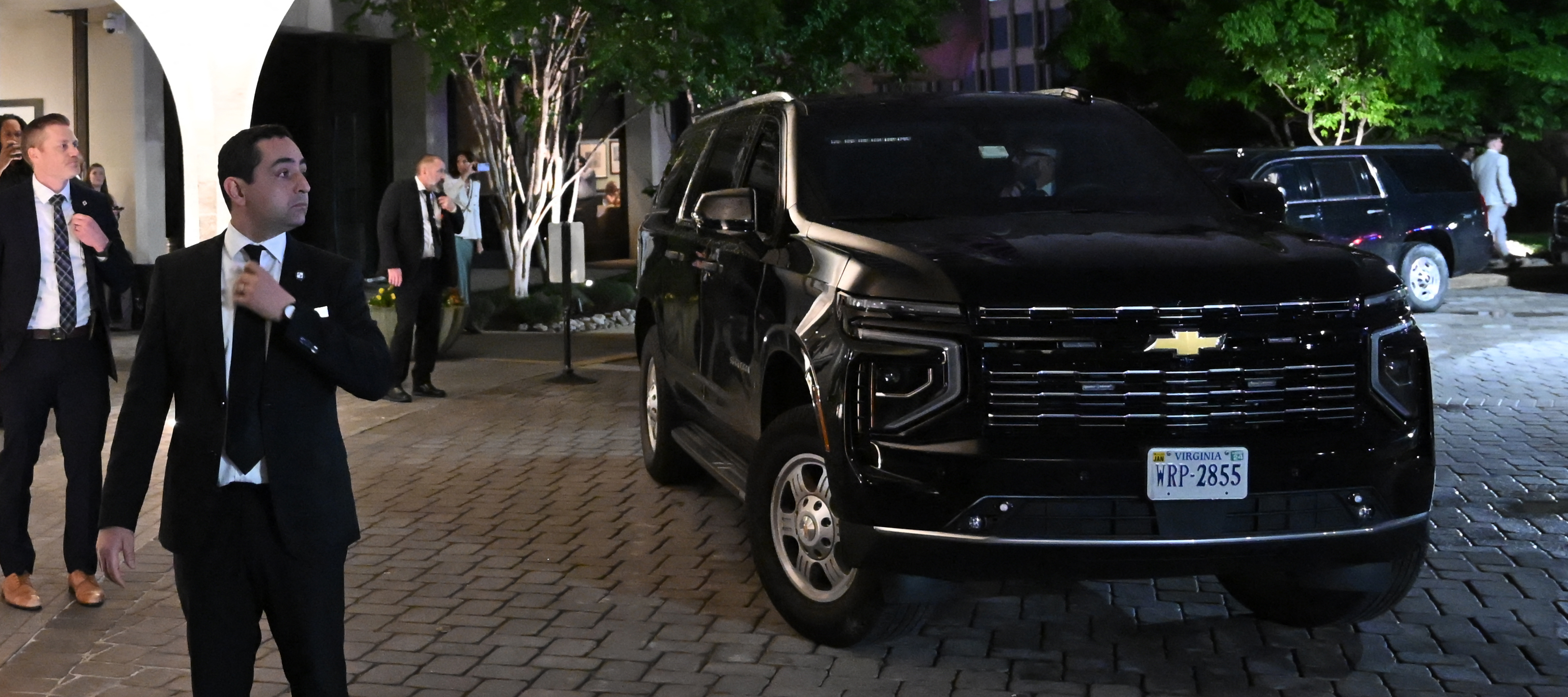 A Secret Service SUV in the foreground outside the Washington Hilton.