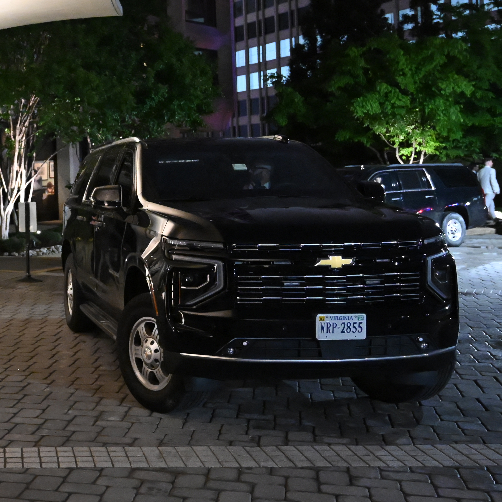 A Secret Service SUV in the foreground outside the Washington Hilton.