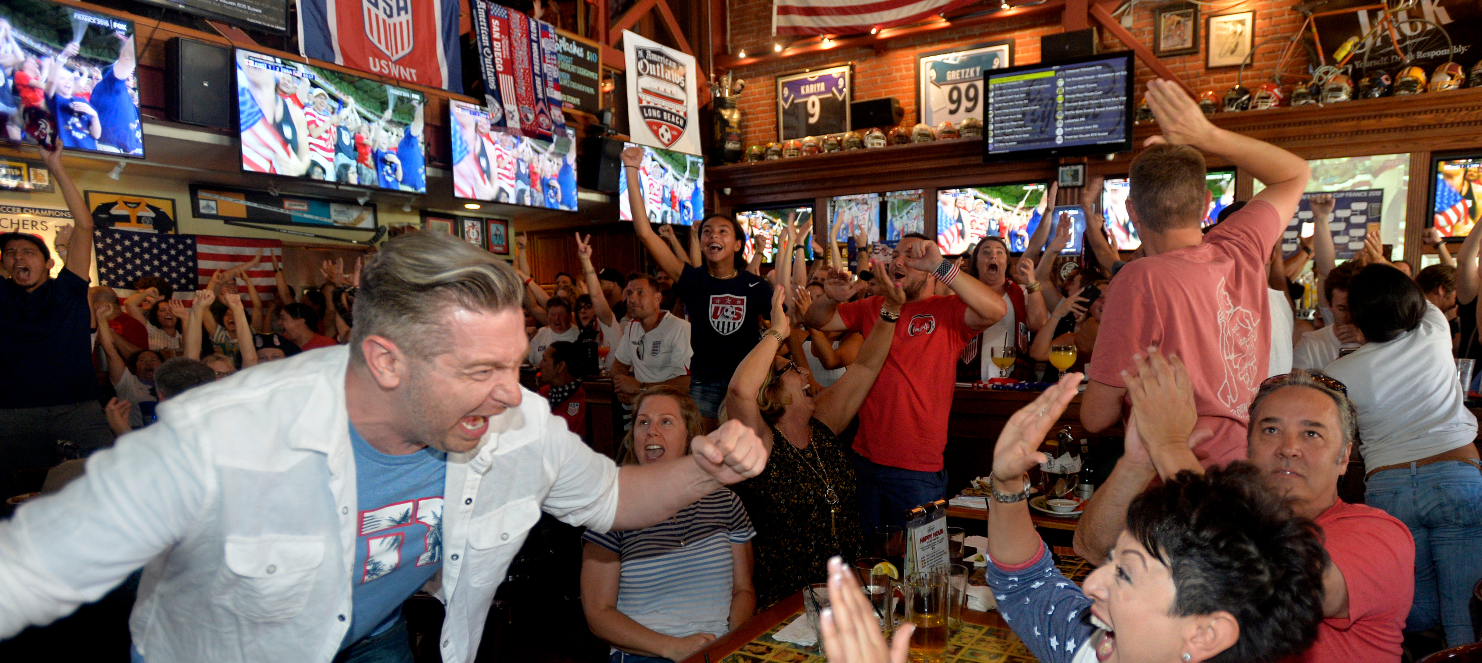 Fans cheer after their side scores a goal in the World Cup.