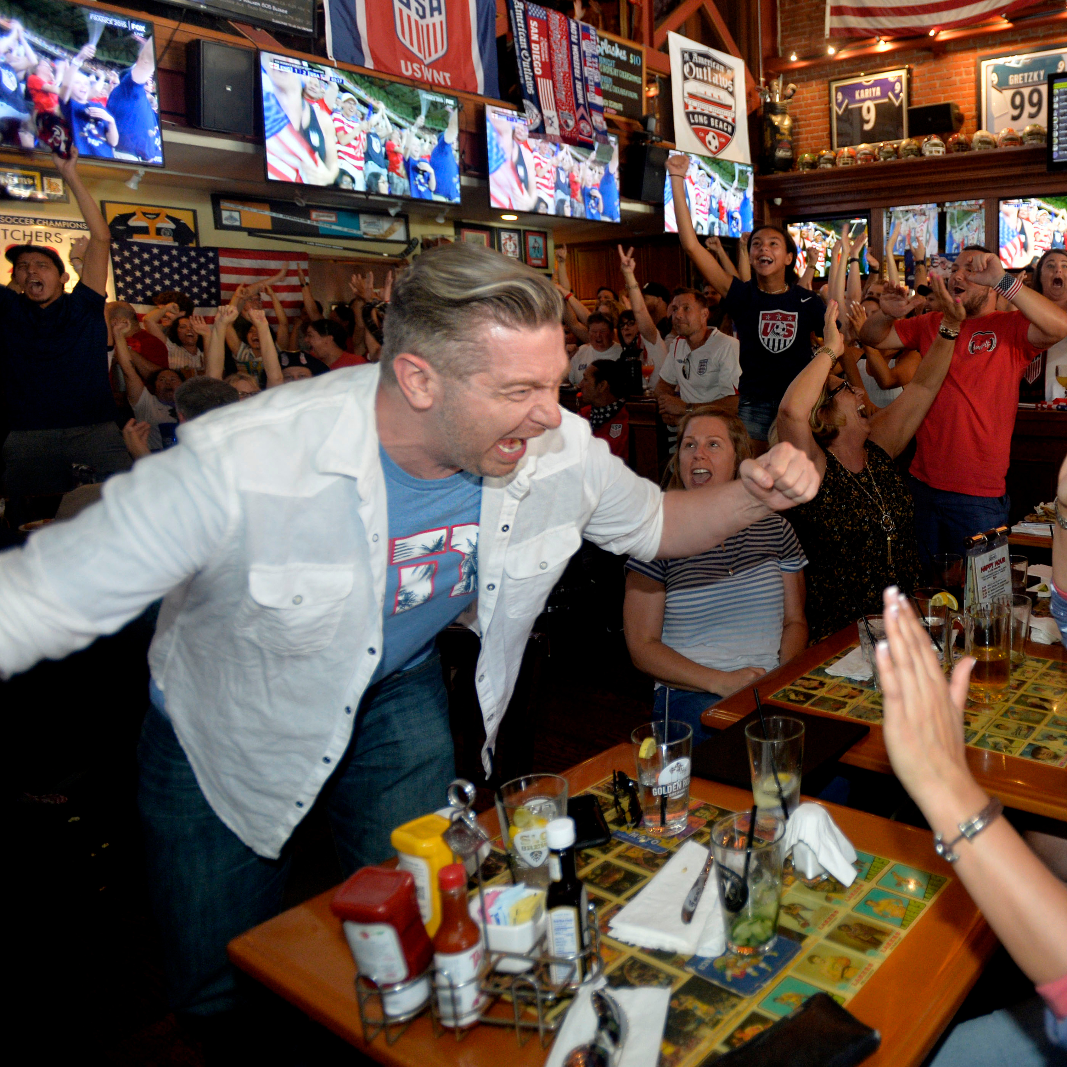 Fans cheer after their side scores a goal in the World Cup.