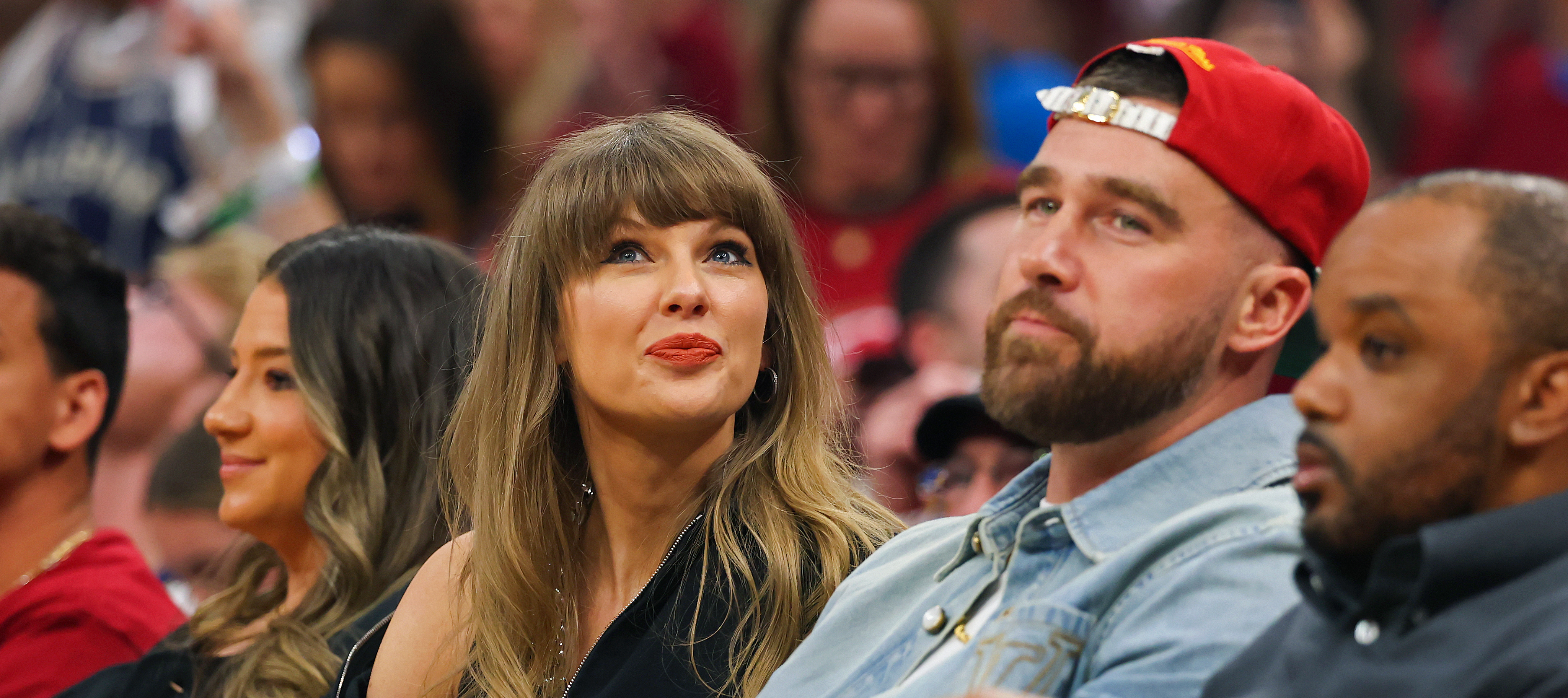 Taylor Swift and Travis Kelce of the Kansas City Chiefs attend Game Three between the New York Knicks and the Cleveland Cavaliers. The chair Swift is sitting in is now up for auction.
