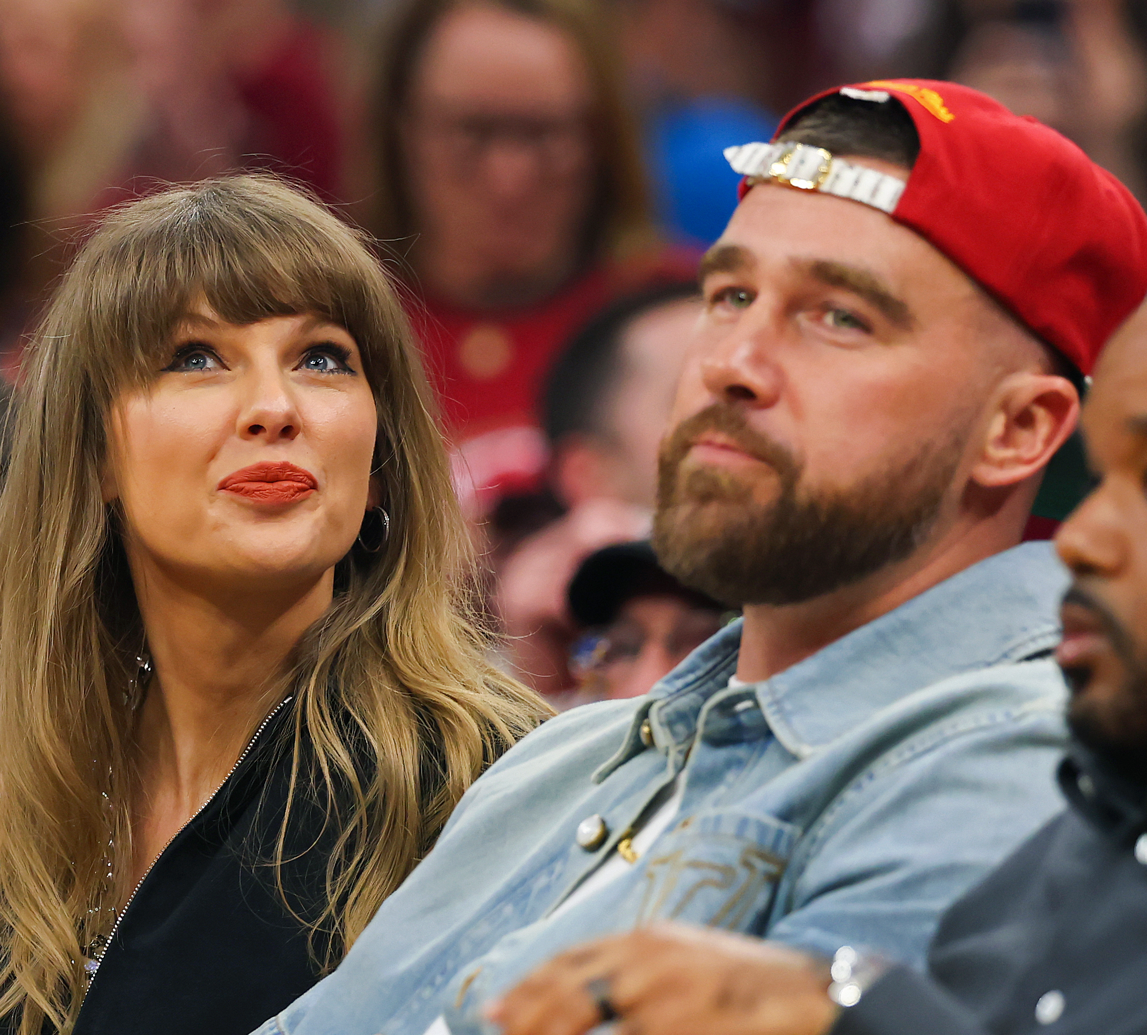 Taylor Swift and Travis Kelce of the Kansas City Chiefs attend Game Three between the New York Knicks and the Cleveland Cavaliers. The chair Swift is sitting in is now up for auction.