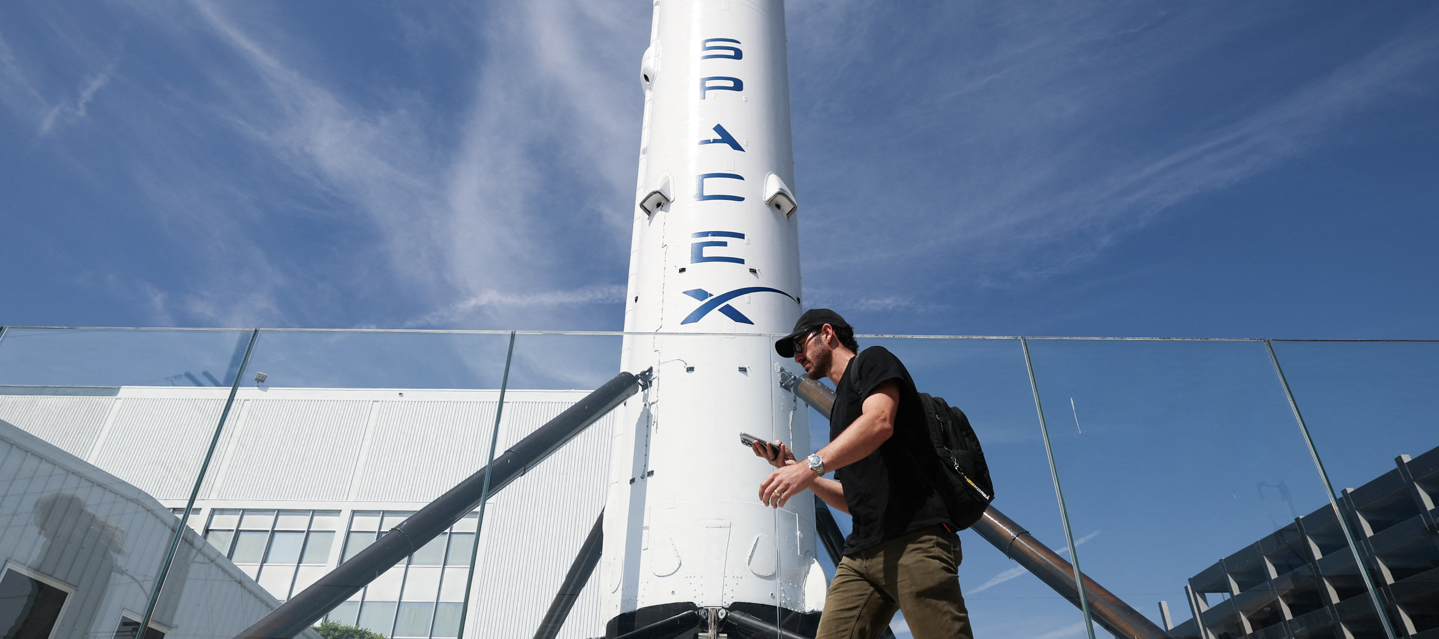 A SpaceX Falcon 9 rocket is displayed outside a Space Exploration Technologies Corp. facility in Hawthorne, California on March 26, 2026.