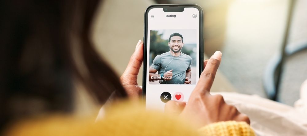 A photo of a woman swiping on a dating app