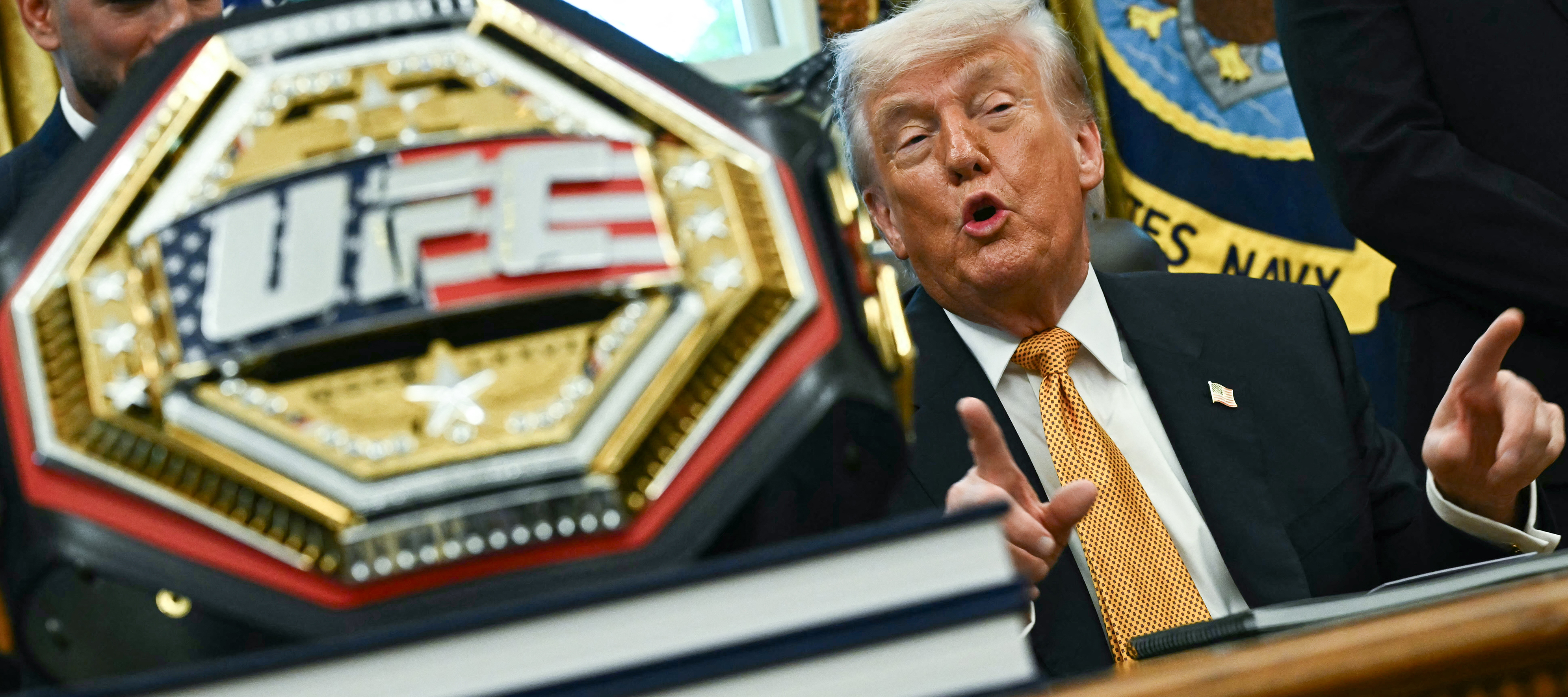 Donald Trump talks to UFC representatives inside the Oval Office.