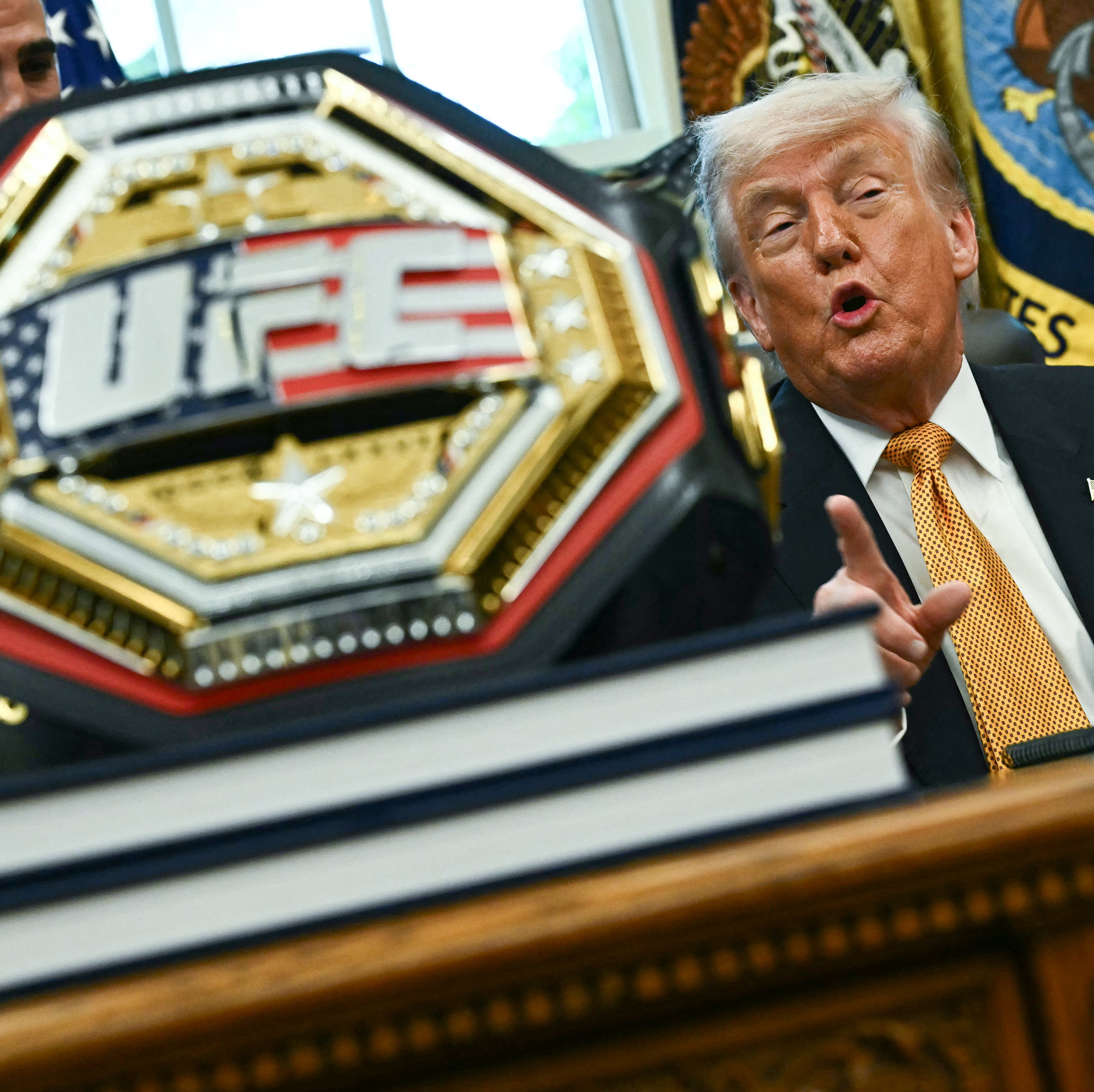 Donald Trump talks to UFC representatives inside the Oval Office.