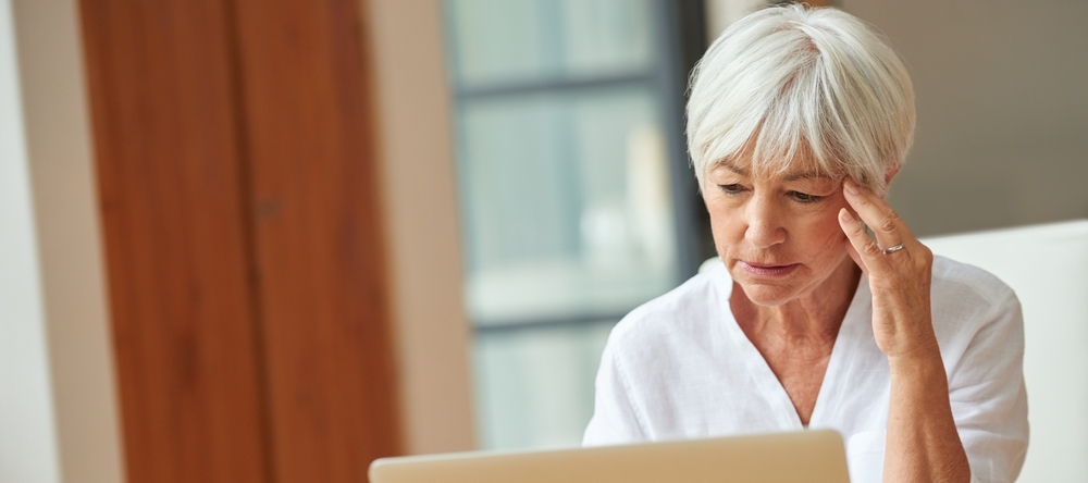 A photo of an older woman thinking