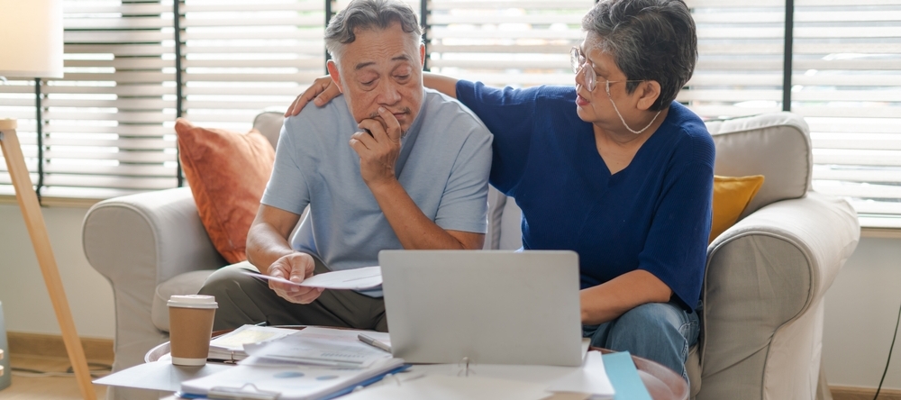 Older couple reviewing paperwork