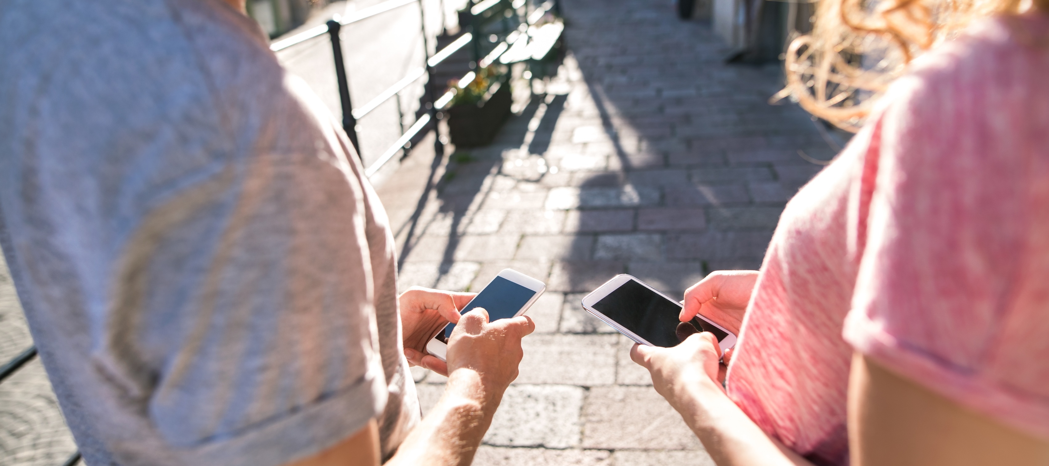 anonymous couple on phones