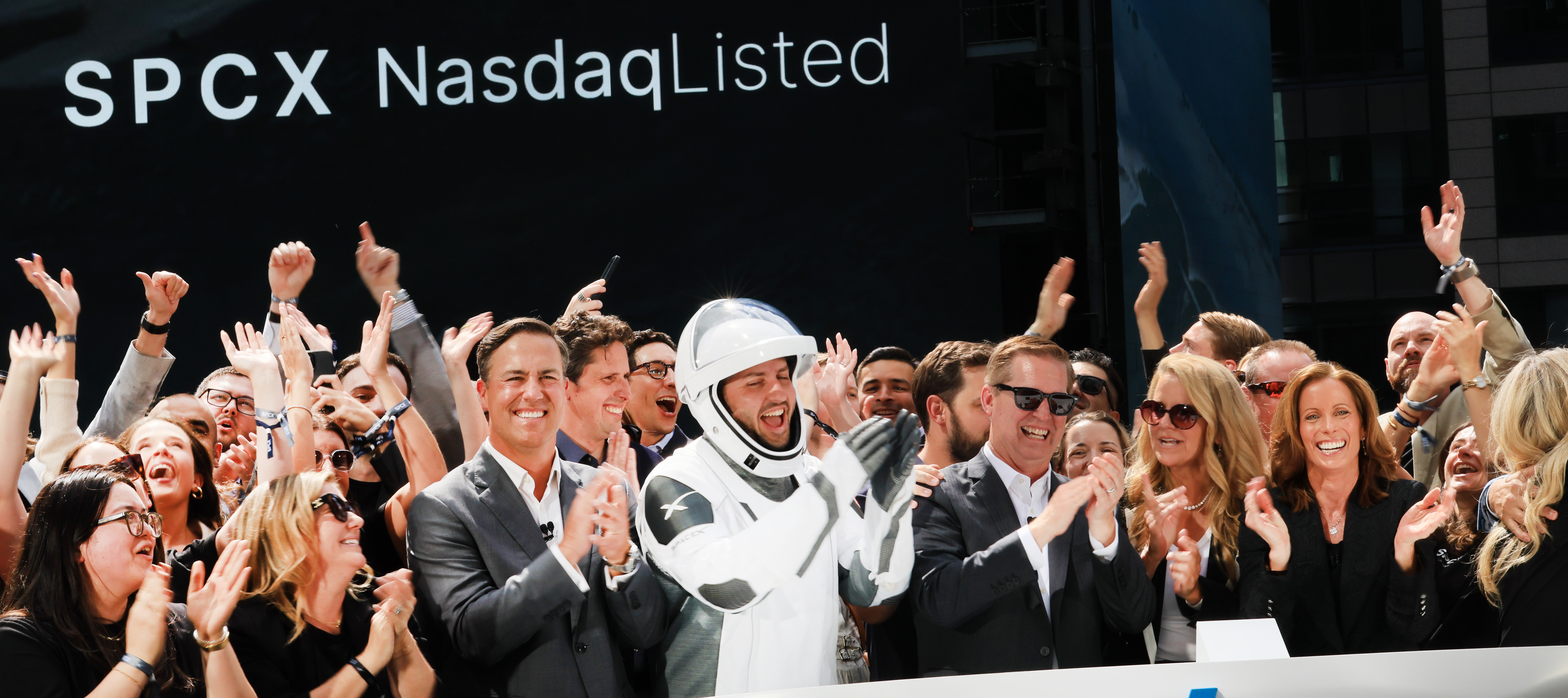 SpaceX employees celebrate the market close of the SpaceX initial public offering (IPO) at the Nasdaq on June 12, 2026, in New York City.
