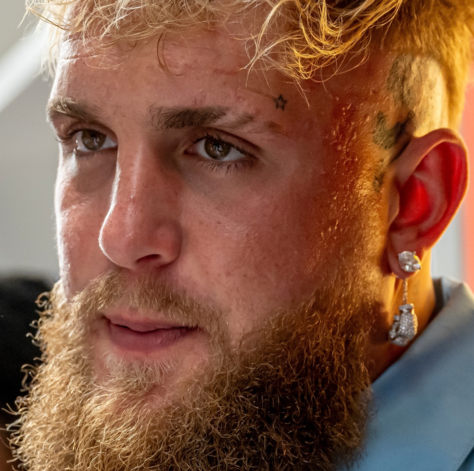A close-up of Jake Paul's face