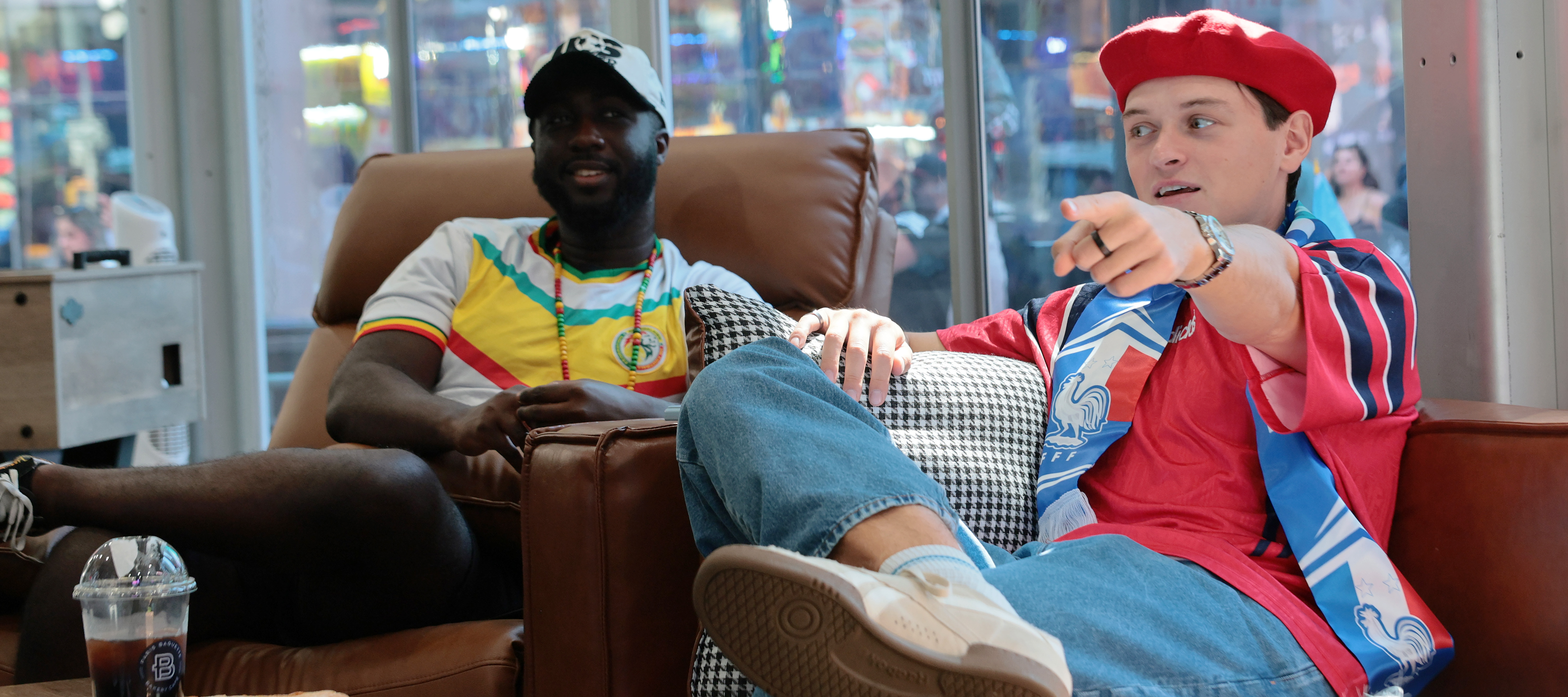 Kevin Akoto and Austin Franklin, FOX One chief World Cup watchers, view the Senegal versus France match in Times Square in New York City.