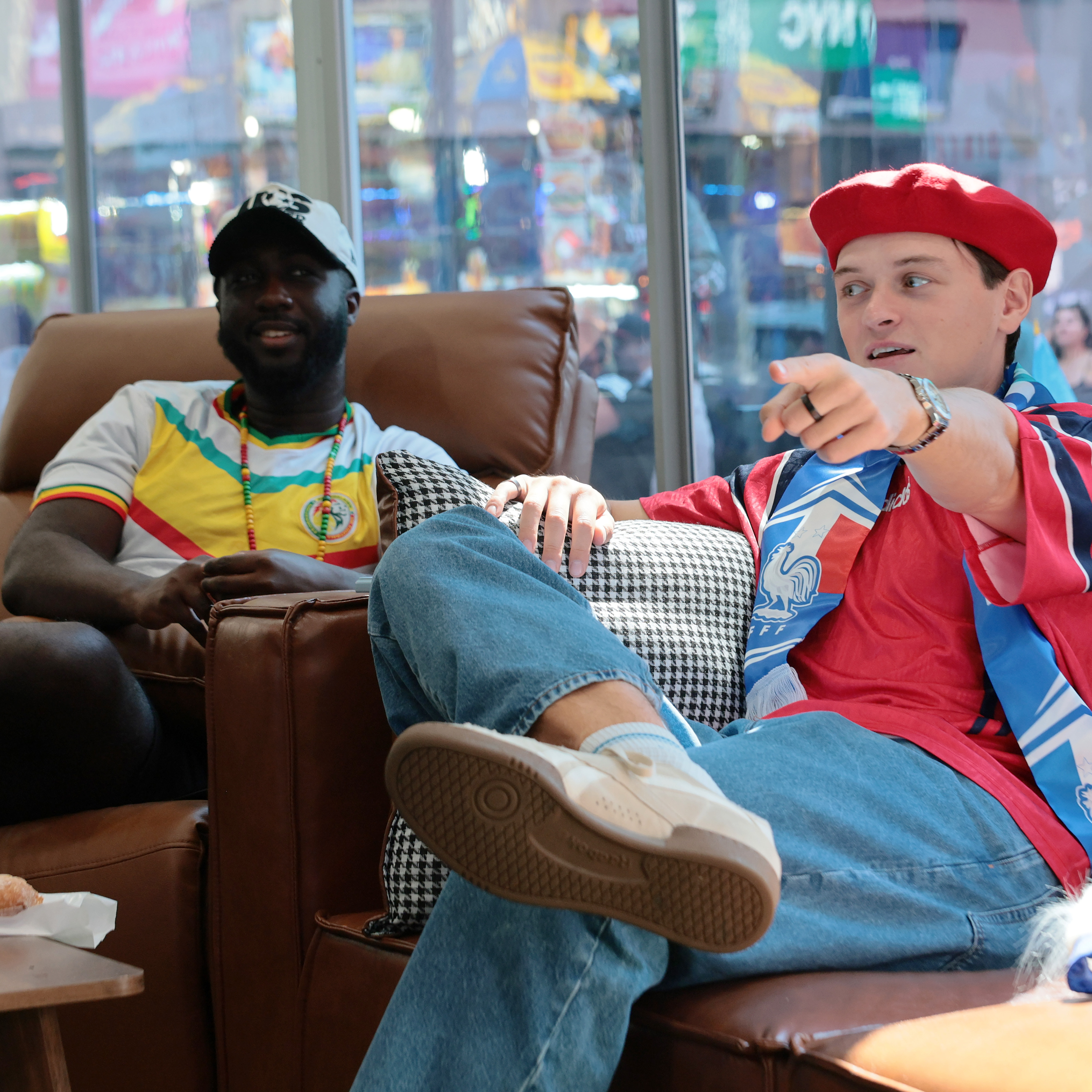 Kevin Akoto and Austin Franklin, FOX One chief World Cup watchers, view the Senegal versus France match in Times Square in New York City.