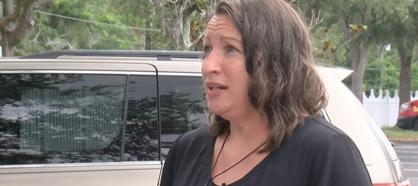 Shawn Hemberger standing in front of her van.