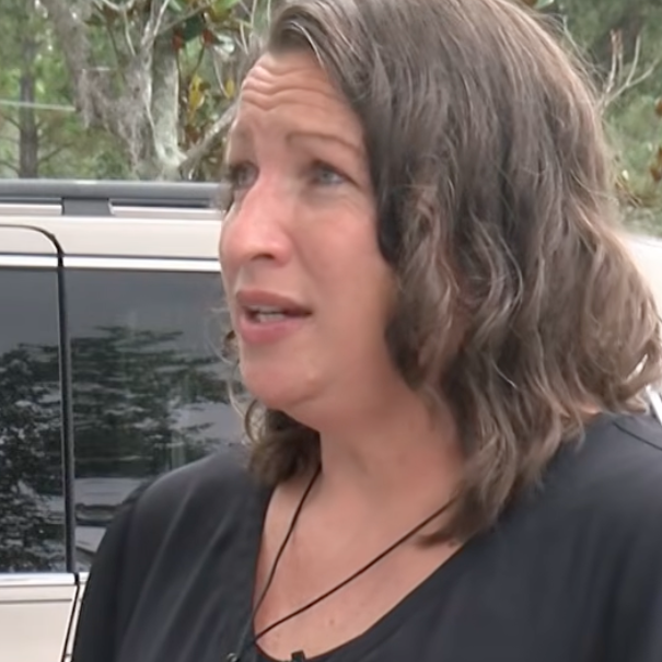Shawn Hemberger standing in front of her van.