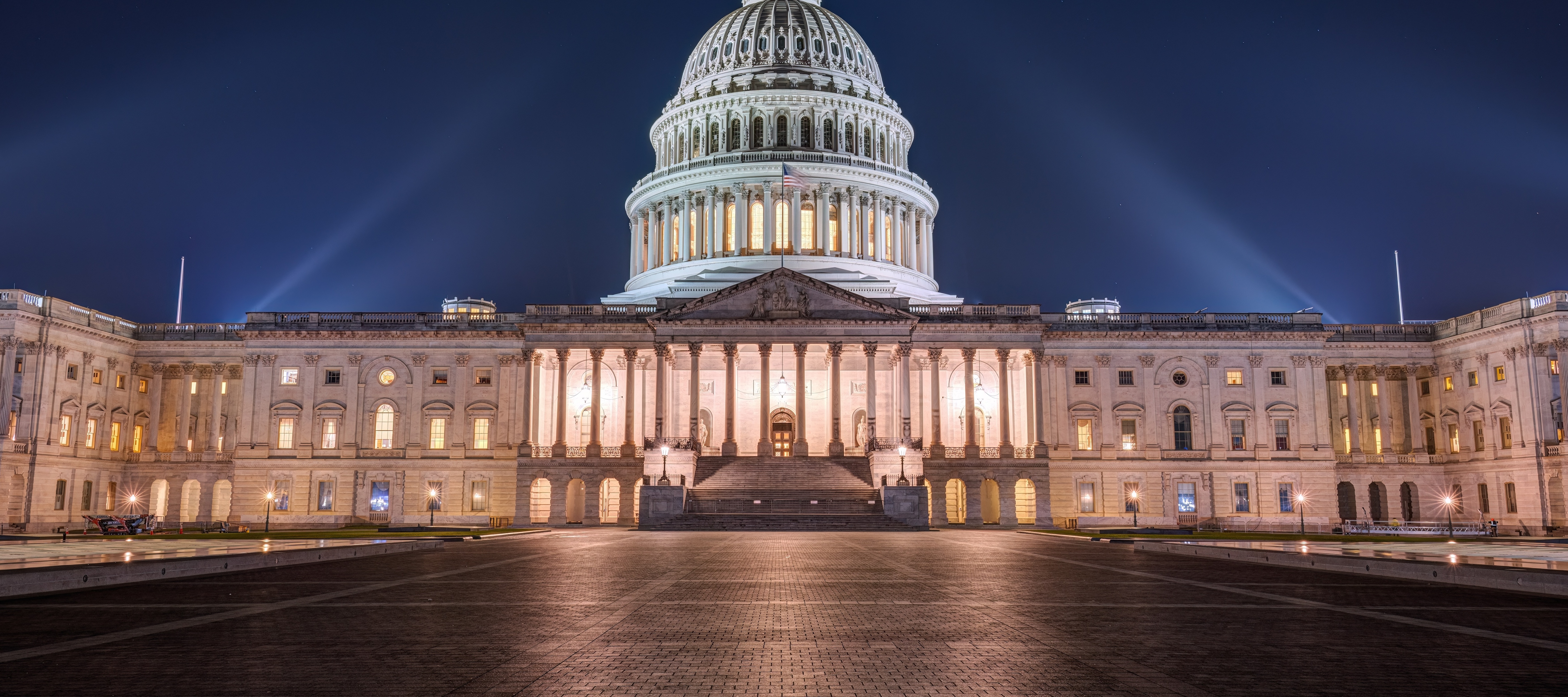 The U.S. Capitol Building in Washington D.C. illuminated at night.