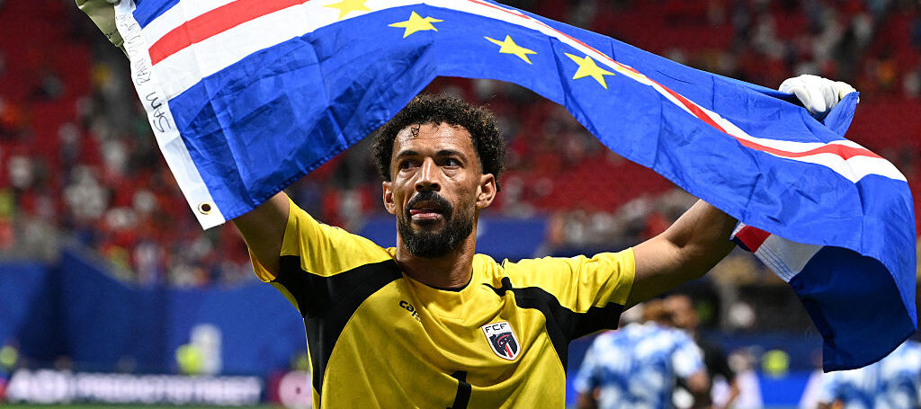 Cape Verde's goalkeeper Vozinha celebrates with his national flag at the end of the 2026 World Cup Group H football match between Spain and Cape Verde
