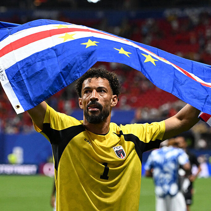 Cape Verde's goalkeeper Vozinha celebrates with his national flag at the end of the 2026 World Cup Group H football match between Spain and Cape Verde