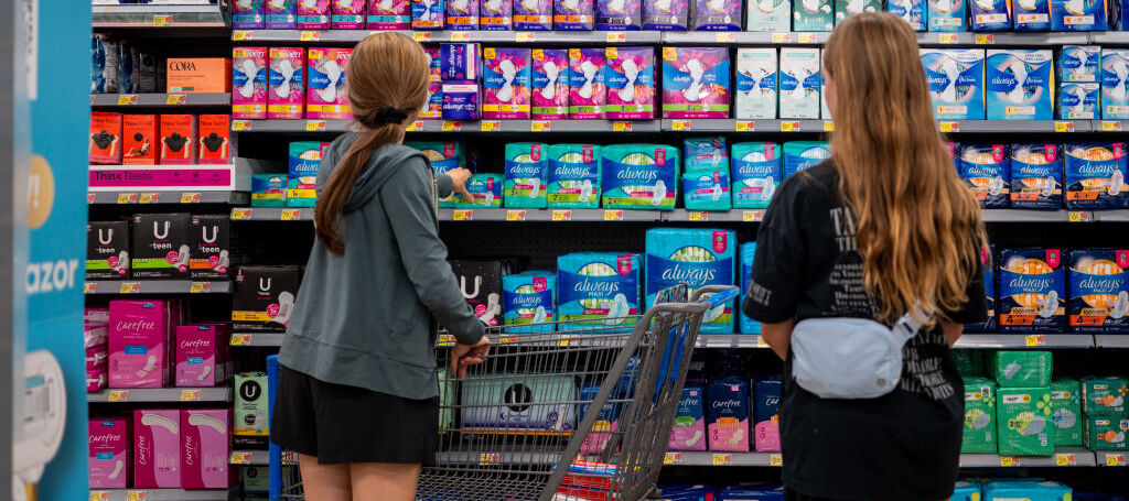 A photo of girls shopping for tampons