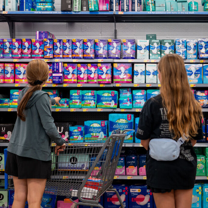 A photo of girls shopping for tampons