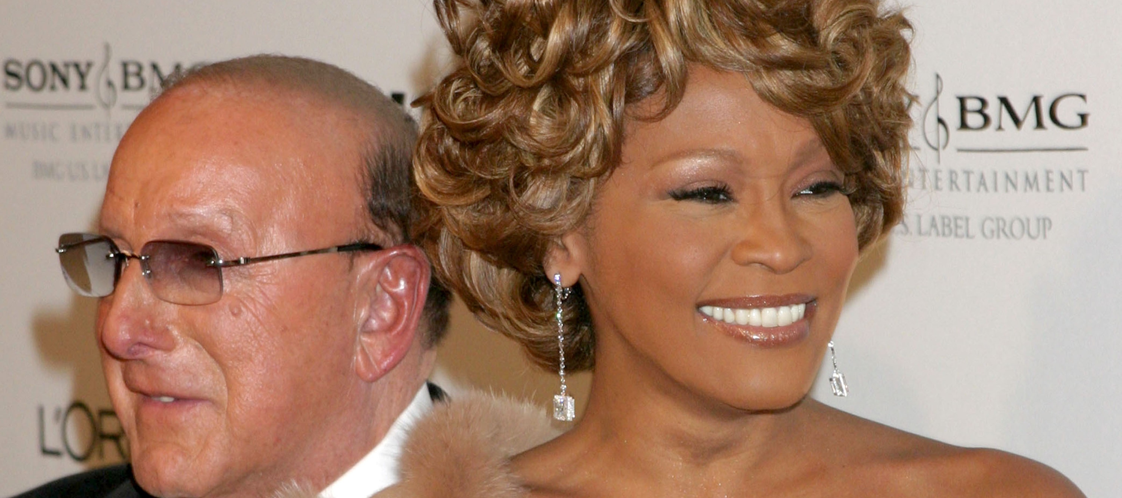Clive Davis, left, stands next to Whitney Houston