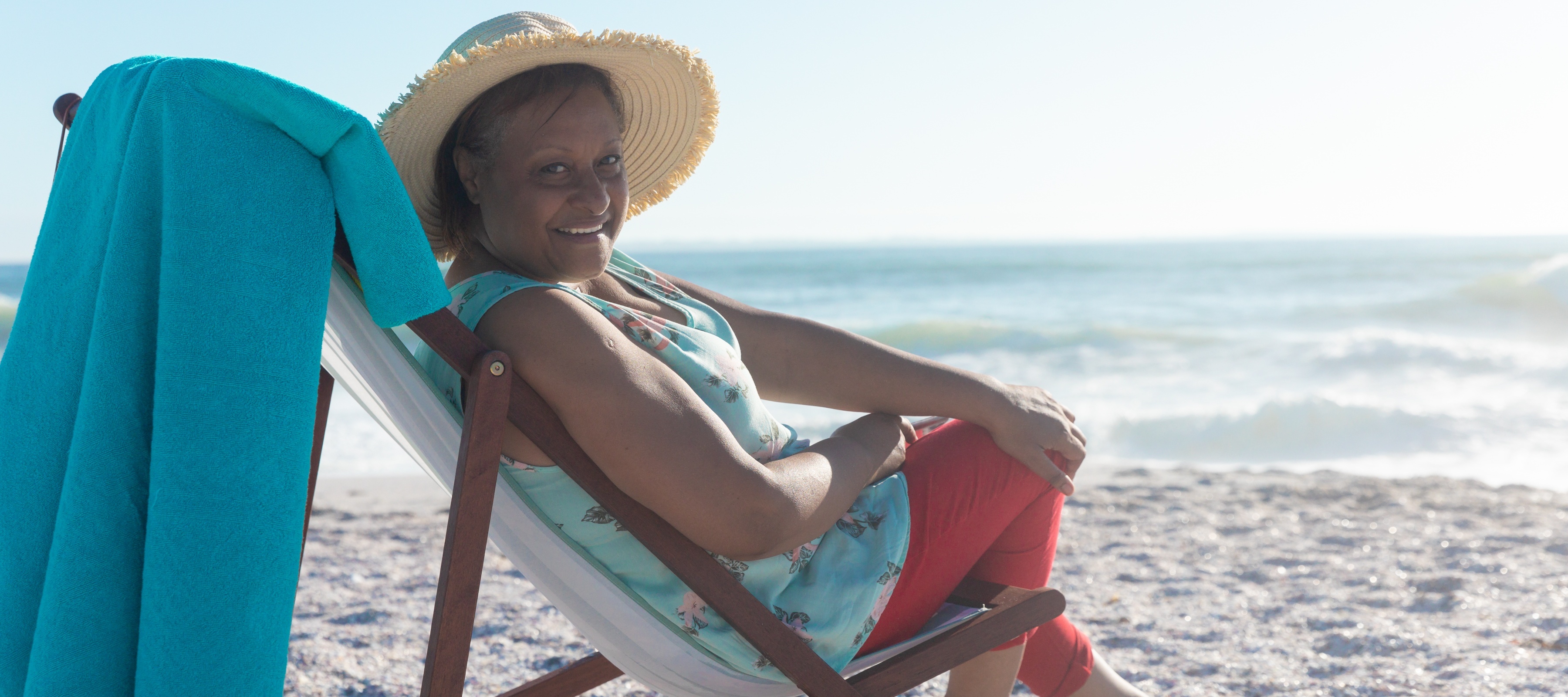 A woman on vacation enjoying the beach