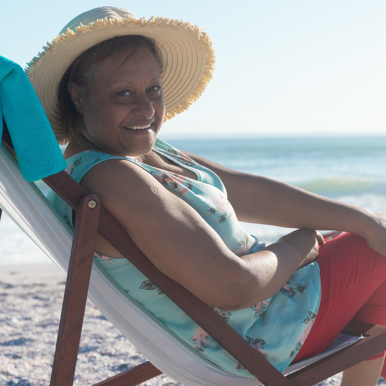 A woman on vacation enjoying the beach