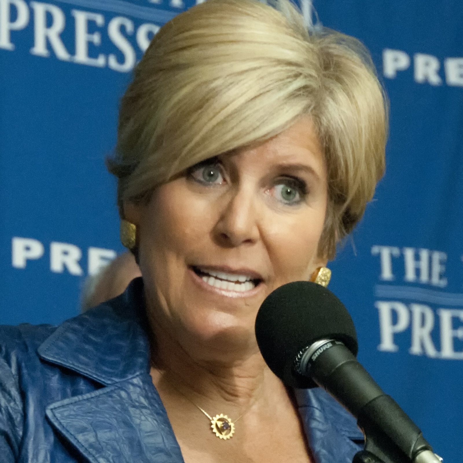 Suze Orman speaks at a press conference at the National Press Club.