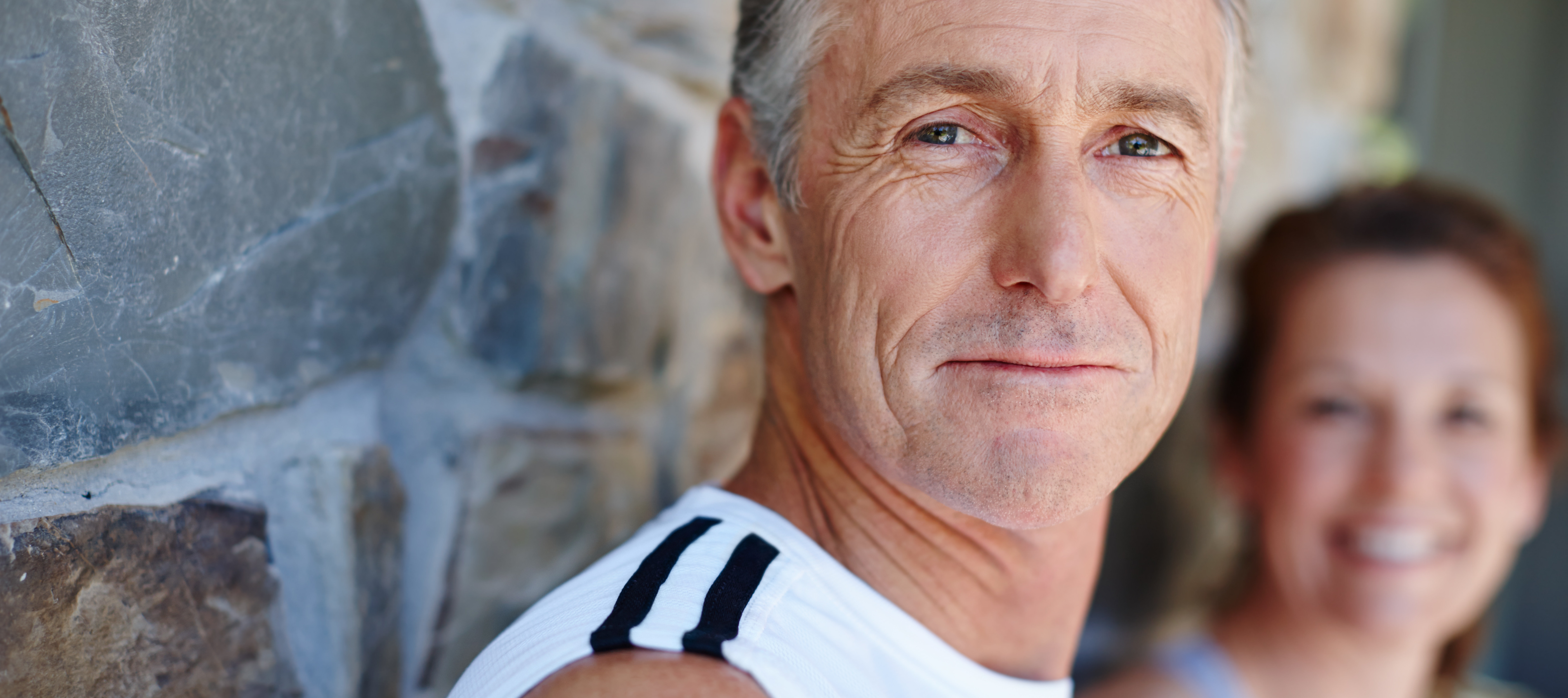 Older man outdoors thinking about financial concerns.