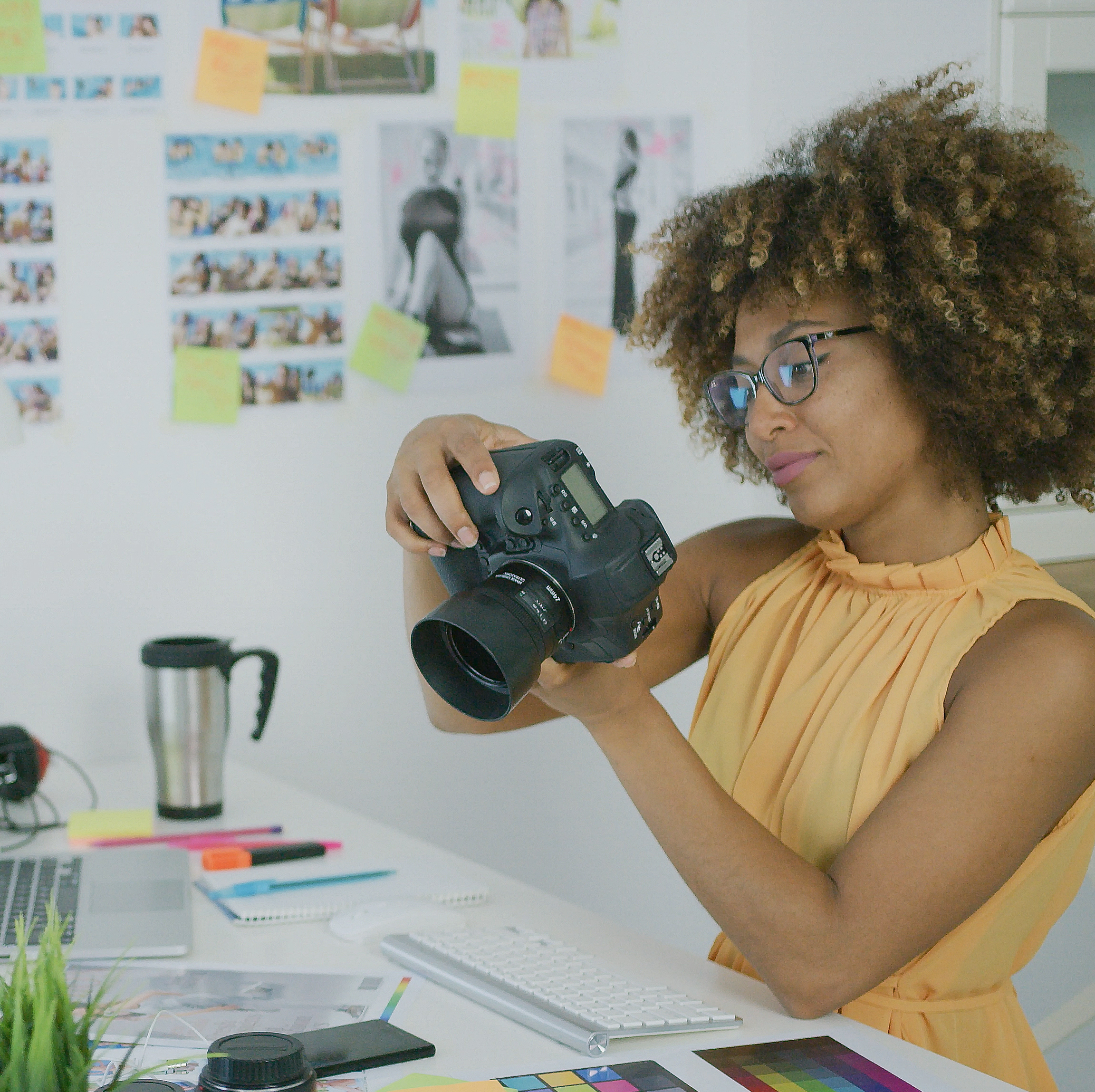Photographer sitting at her desk looking at photos
