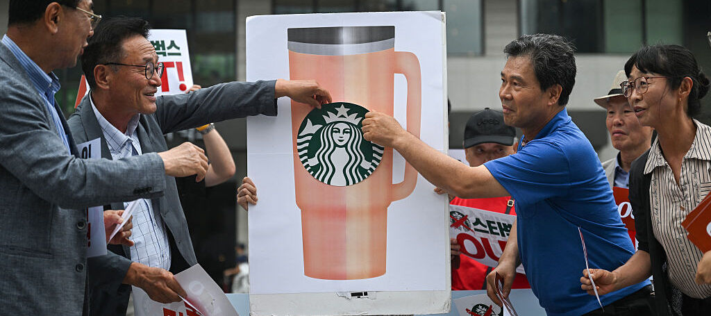 Protesters call for a boycott of Starbucks in Seoul.