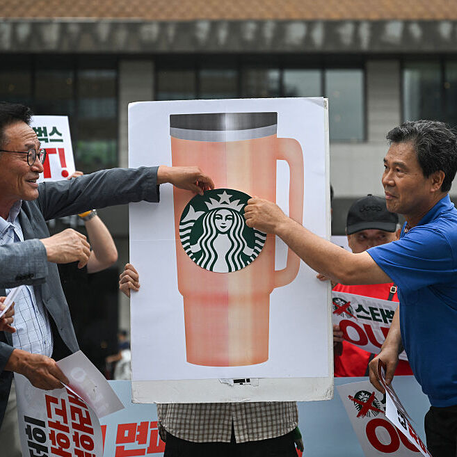 Protesters call for a boycott of Starbucks in Seoul.