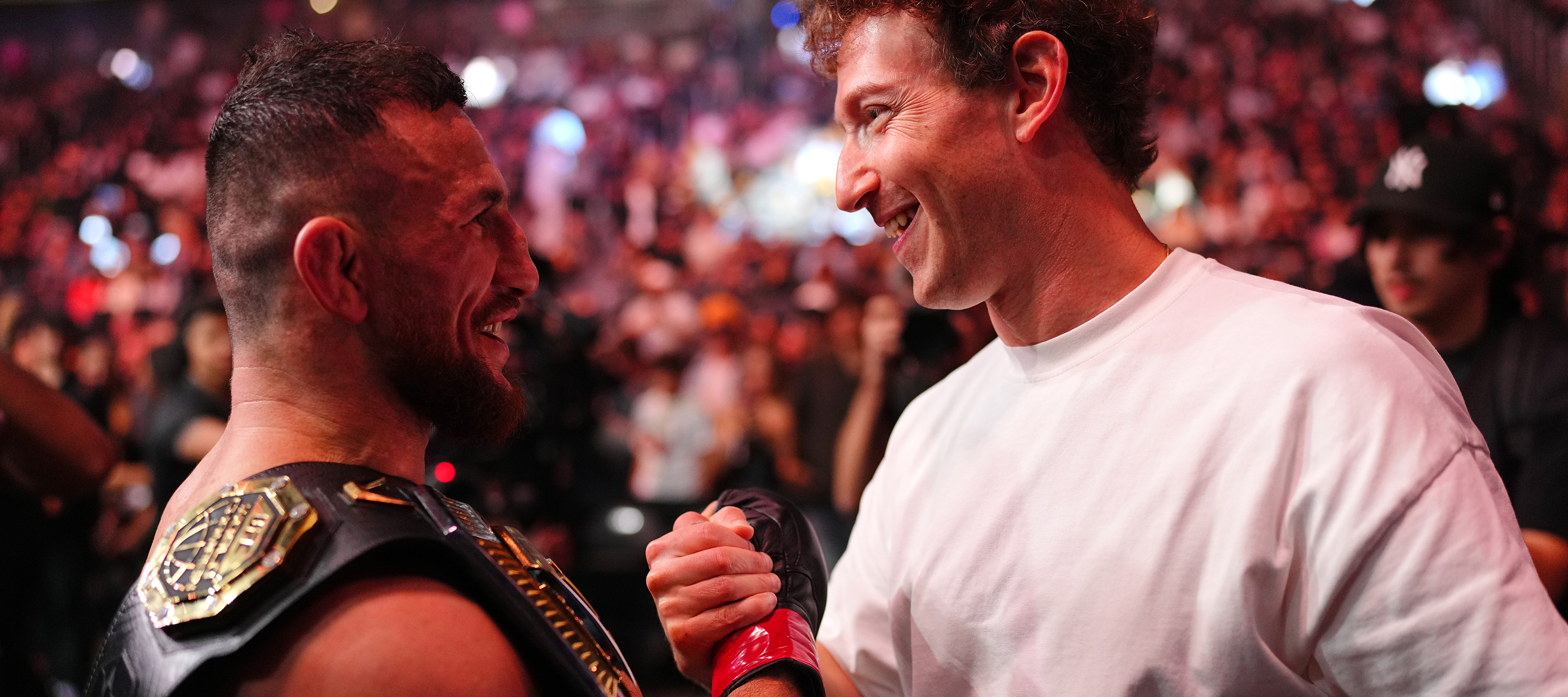 Mark Zuckerberg shakes hands with Merab Dvalishvili following his win in the UFC bantamweight championship fight during UFC 320.