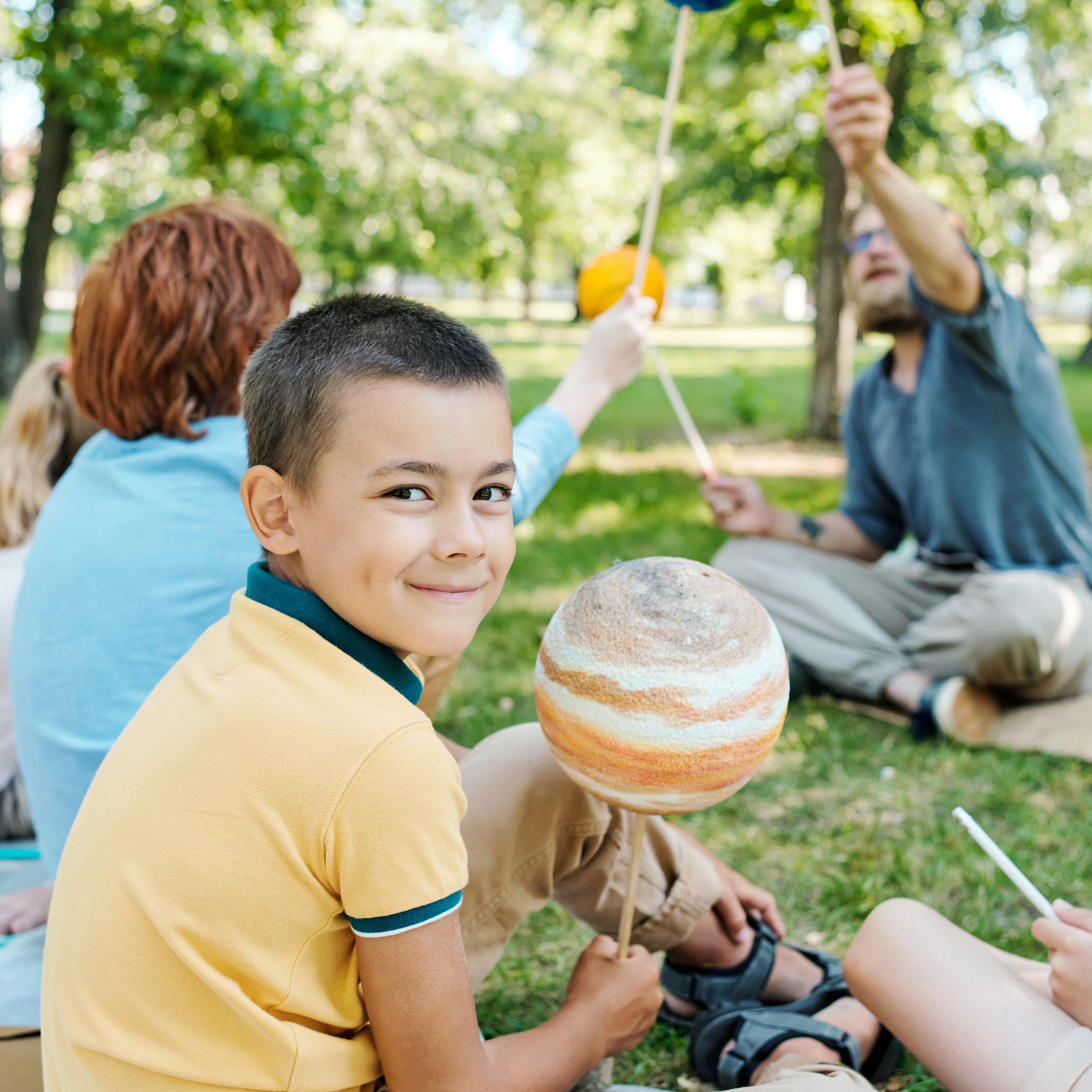 Young child learning about solar system at summer camp