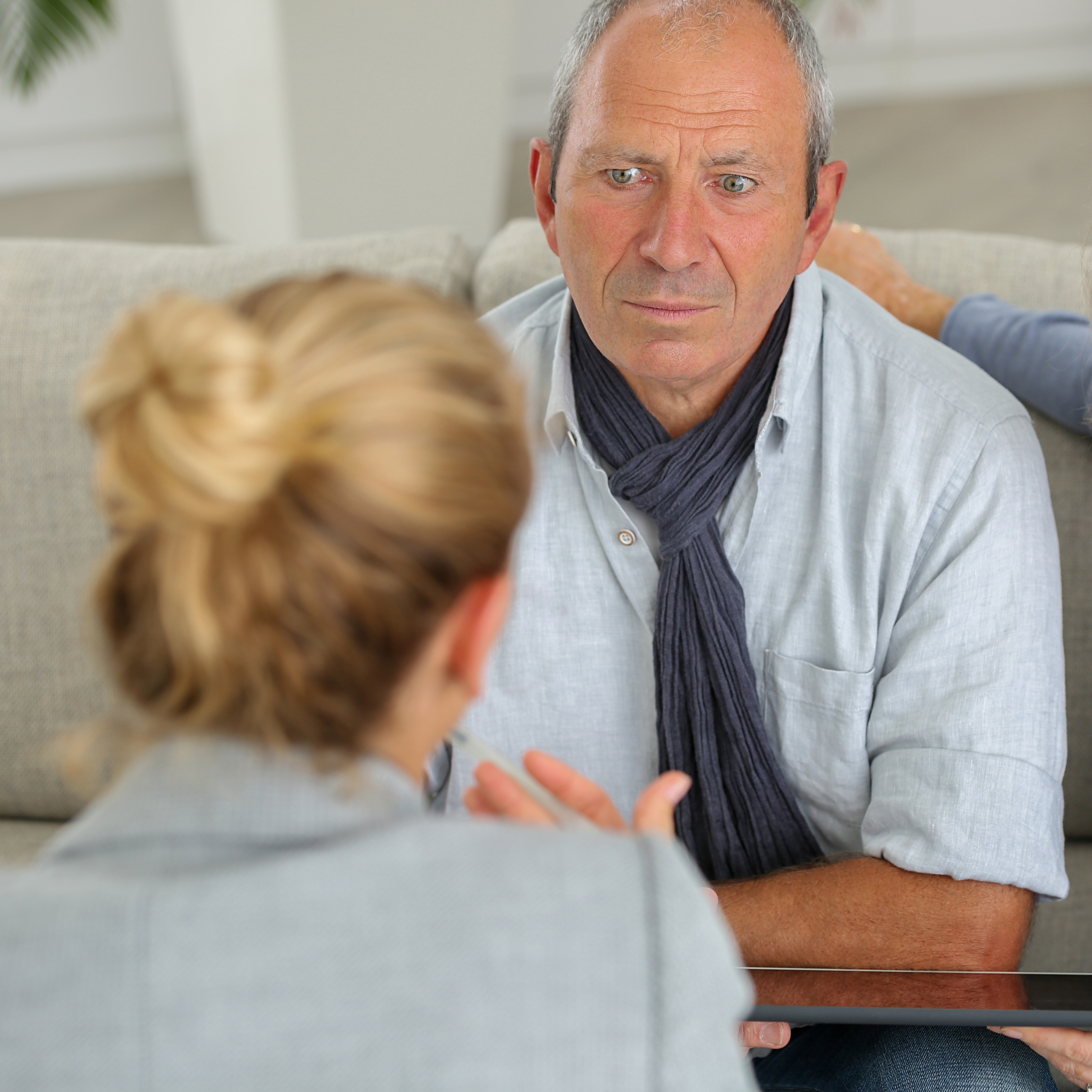 A young woman discussing an issue with her parents.