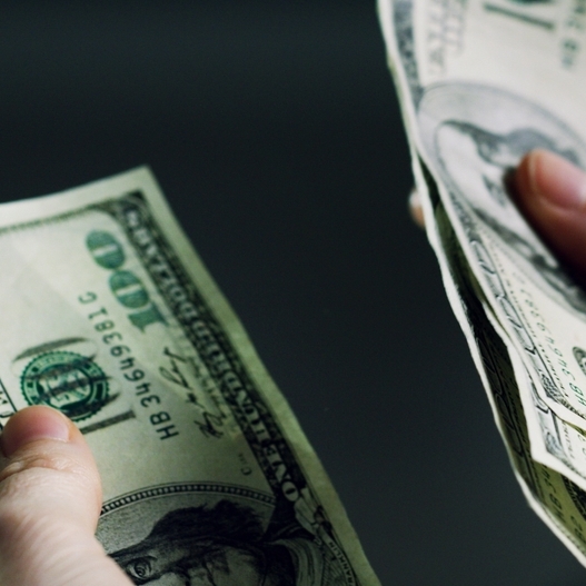 A photo of someone counting cash
