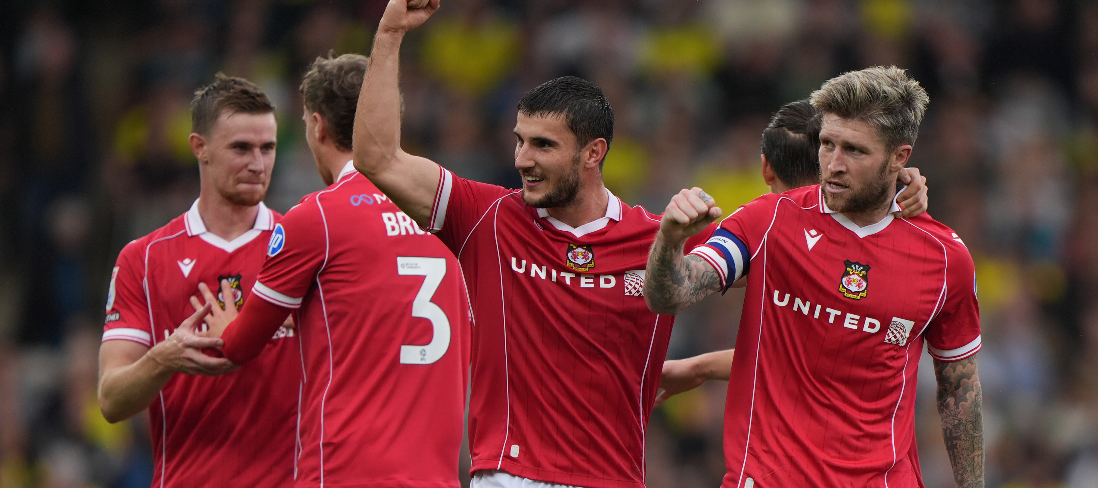 Wrexham soccer players celebrating
