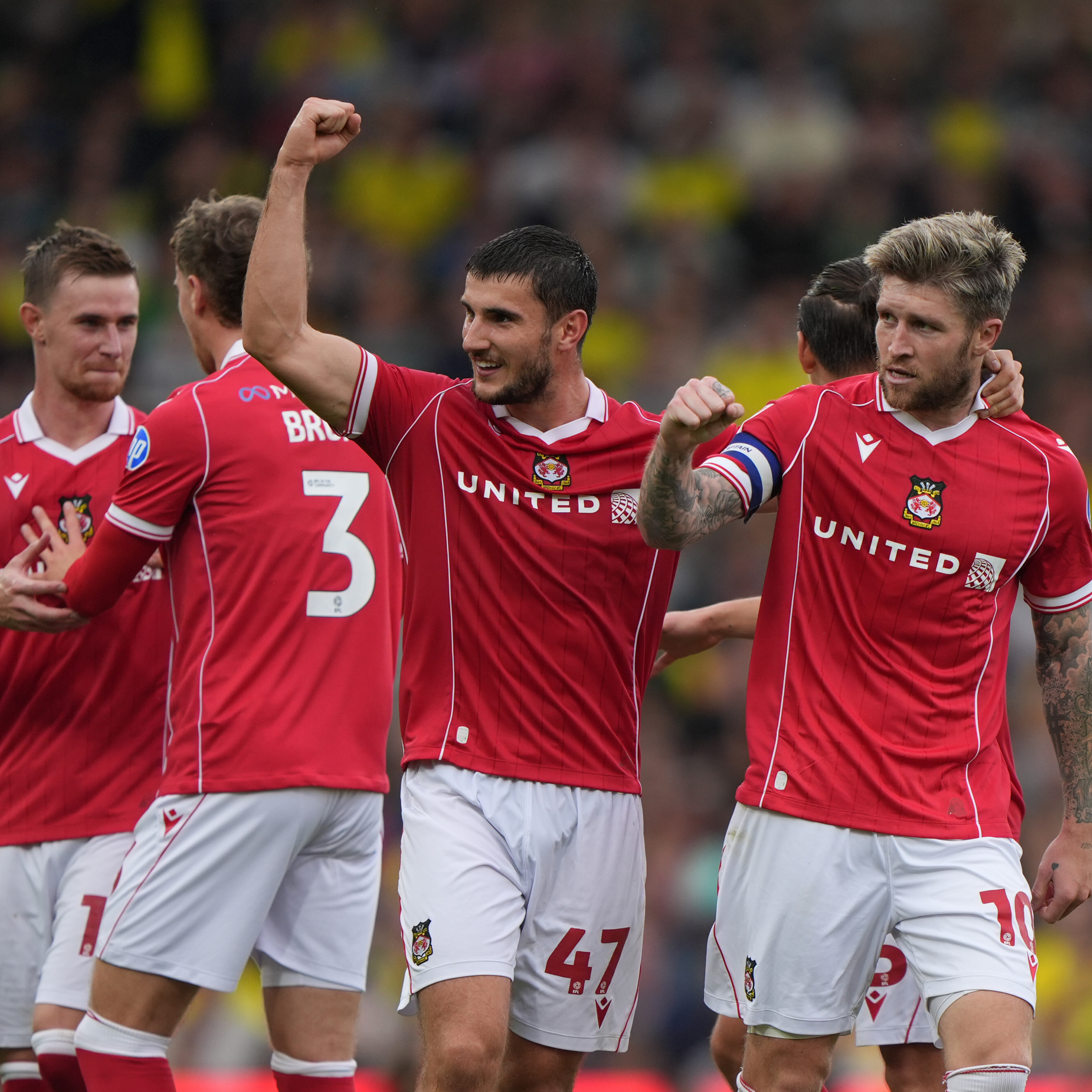 Wrexham soccer players celebrating