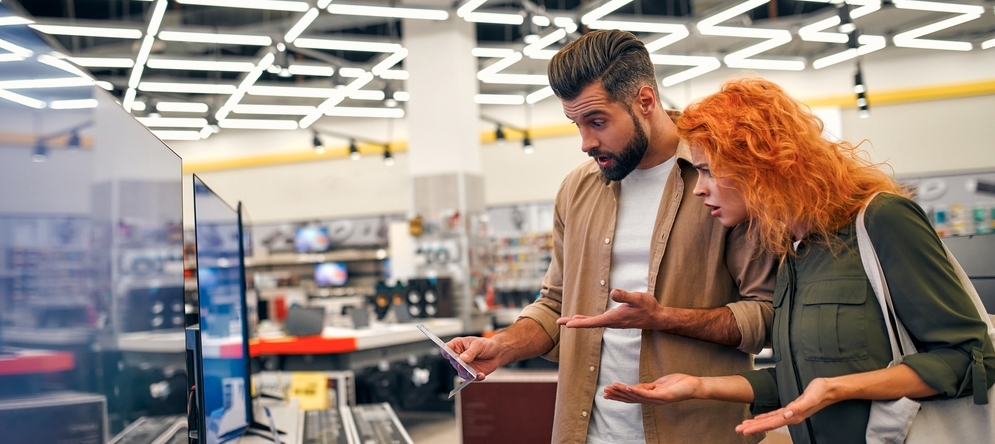 Couple shocked at the price of electronics.