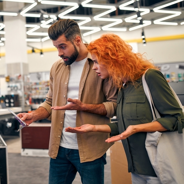 Couple shocked at the price of electronics.