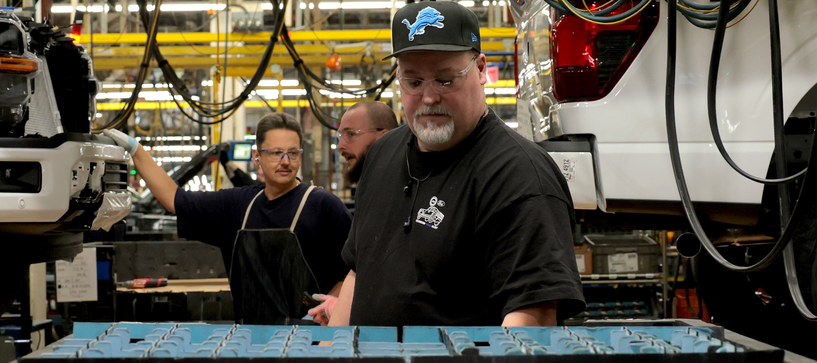 Ford employees work on F-150 trucks at the River Rouge Complex in Dearborn, Michigan.