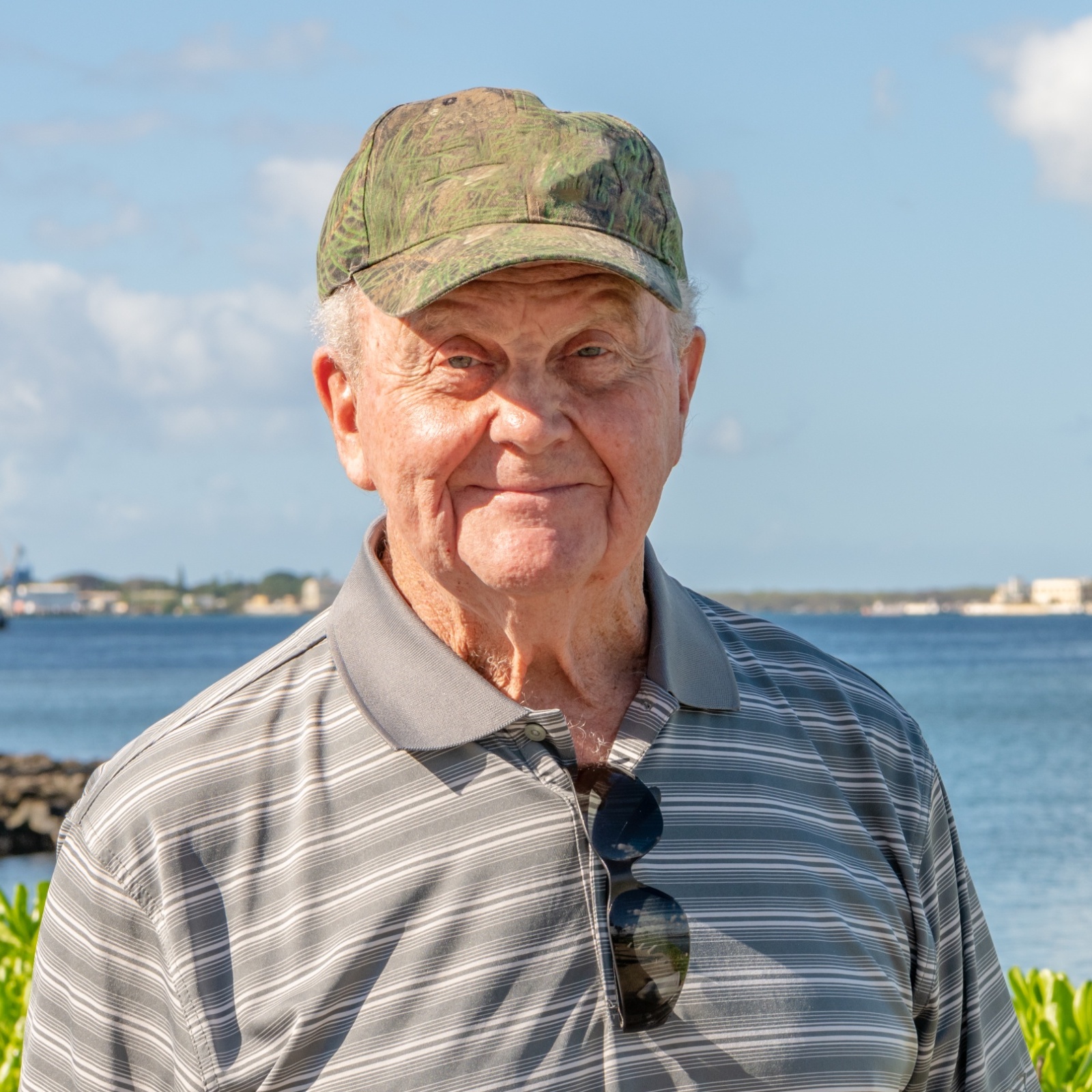 A senior man, a veteran, visiting historical sites during a family trip to Hawaii.