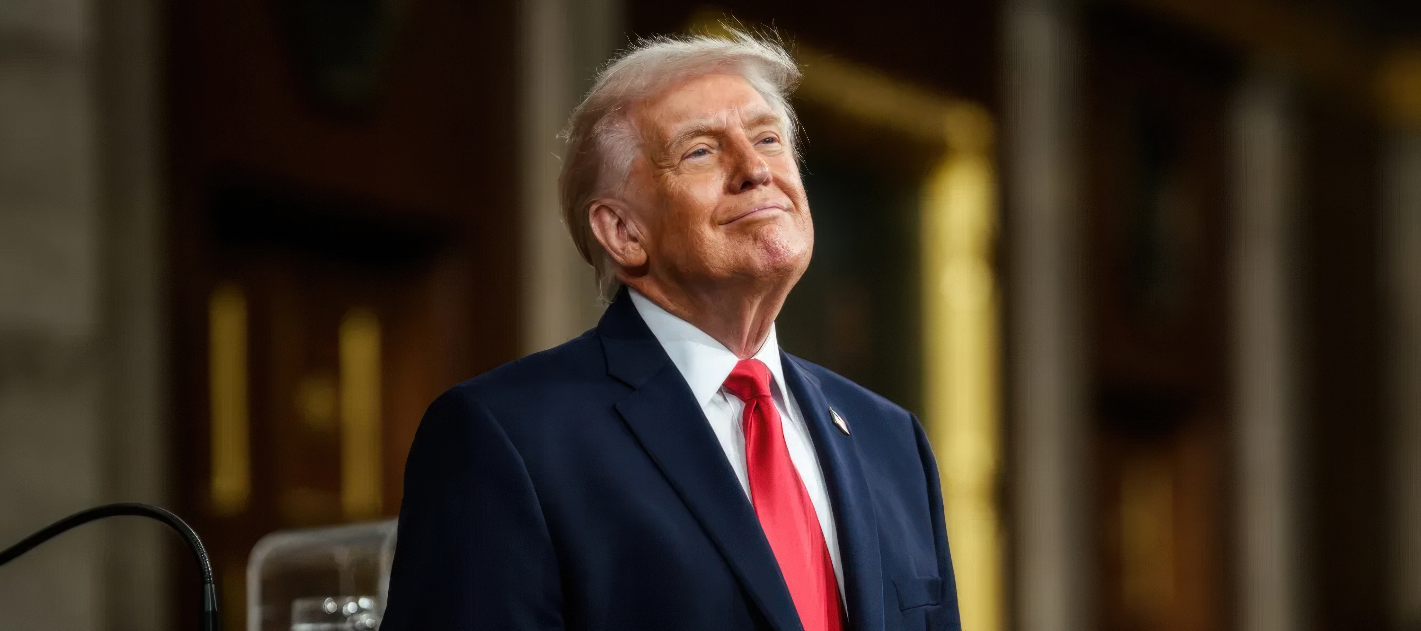 A photo of President Donald Trump smiling while delivering his first official State of the Union address of his second term.