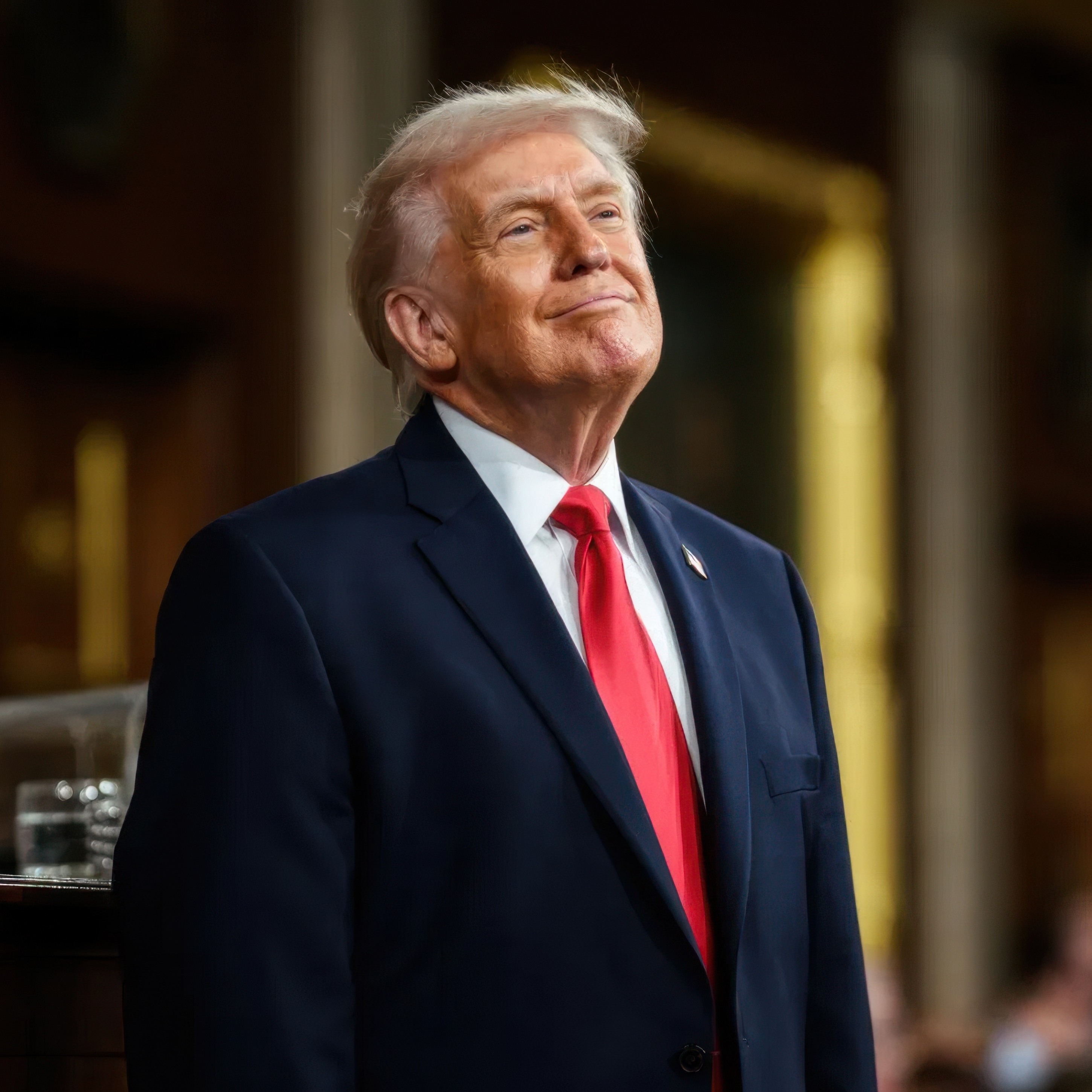 A photo of President Donald Trump smiling while delivering his first official State of the Union address of his second term.
