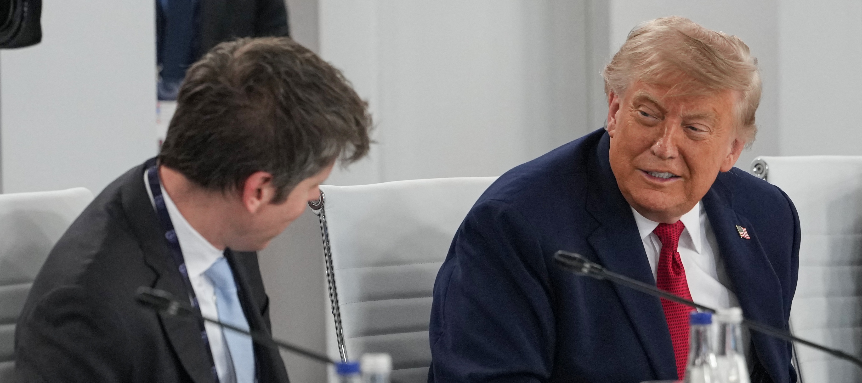 Donald Trump smiles while talking with OpenAI CEO Sam Altman