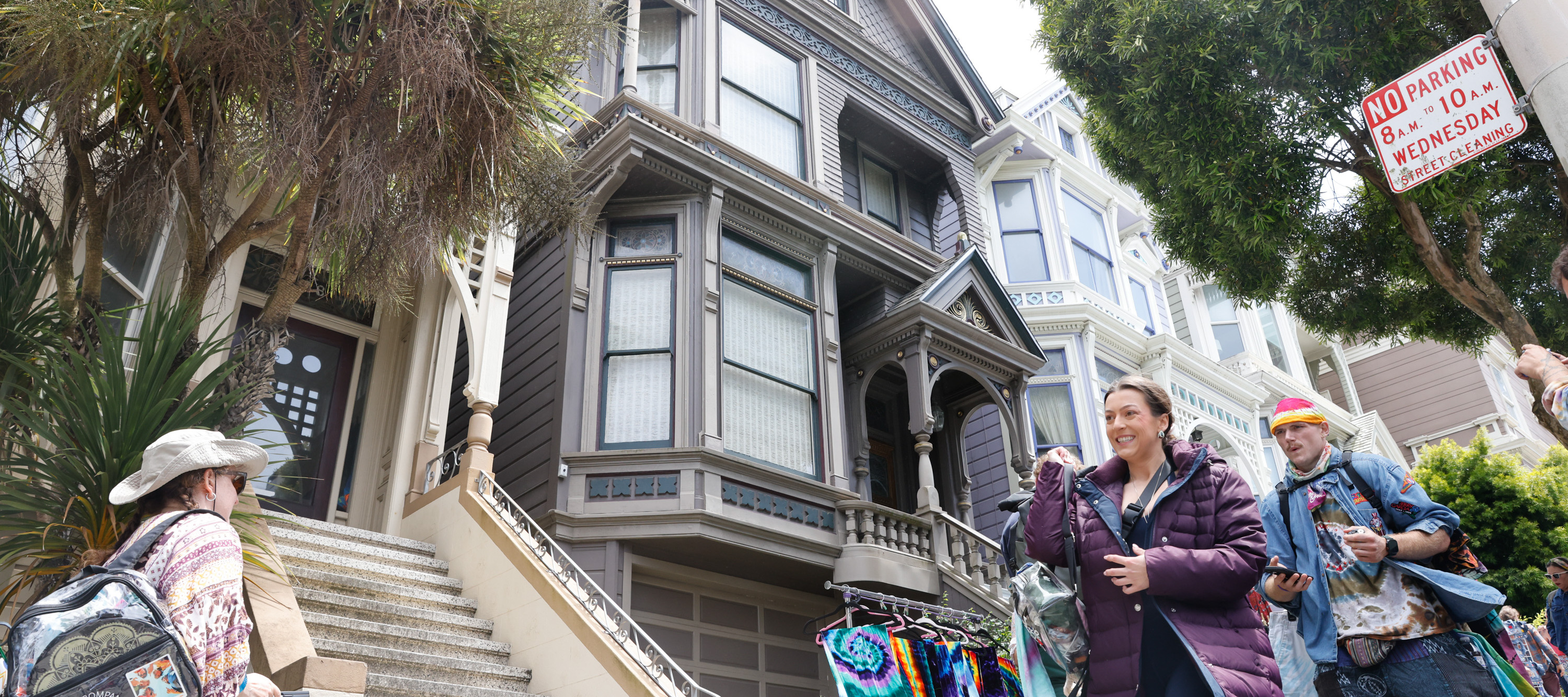 People visit the Grateful Dead house at 710 Ashbury.