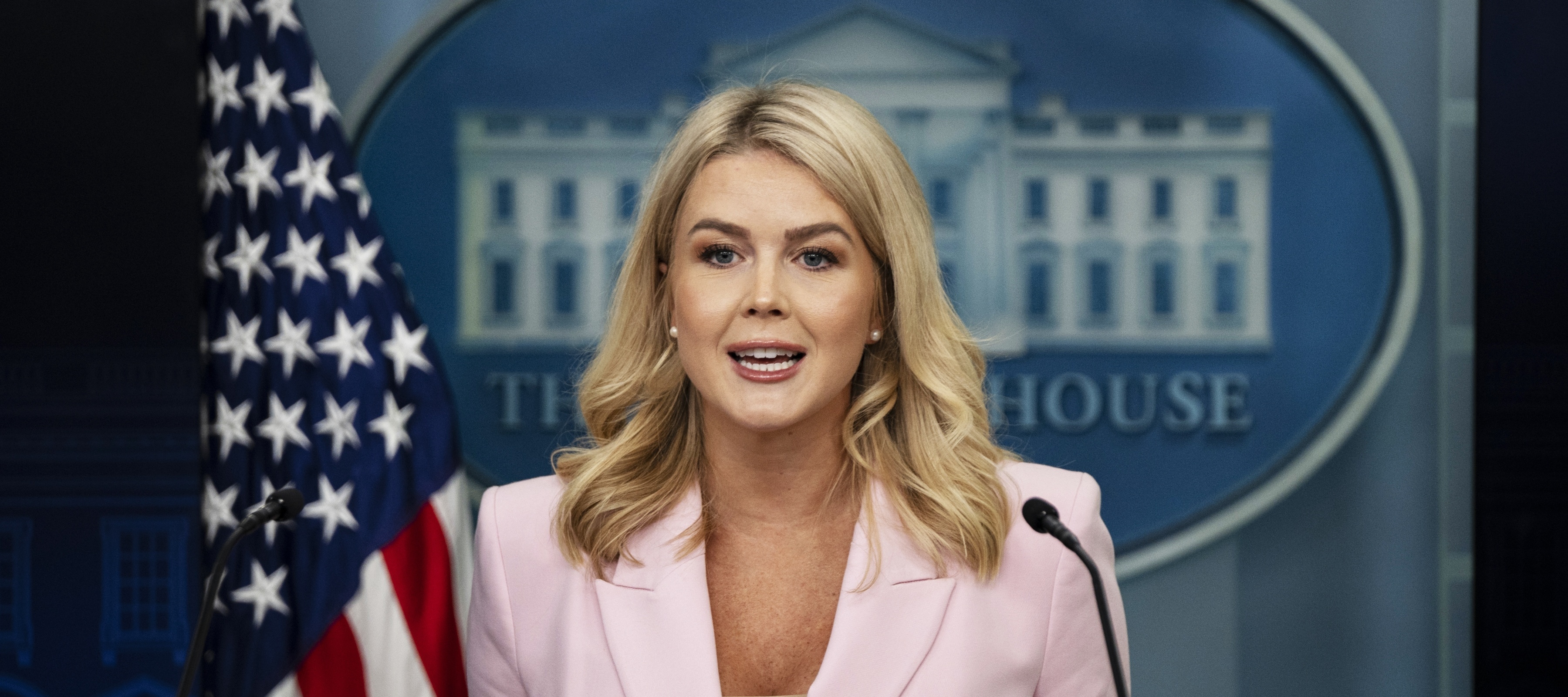 Karoline Leavitt speaks in front of a White House podium