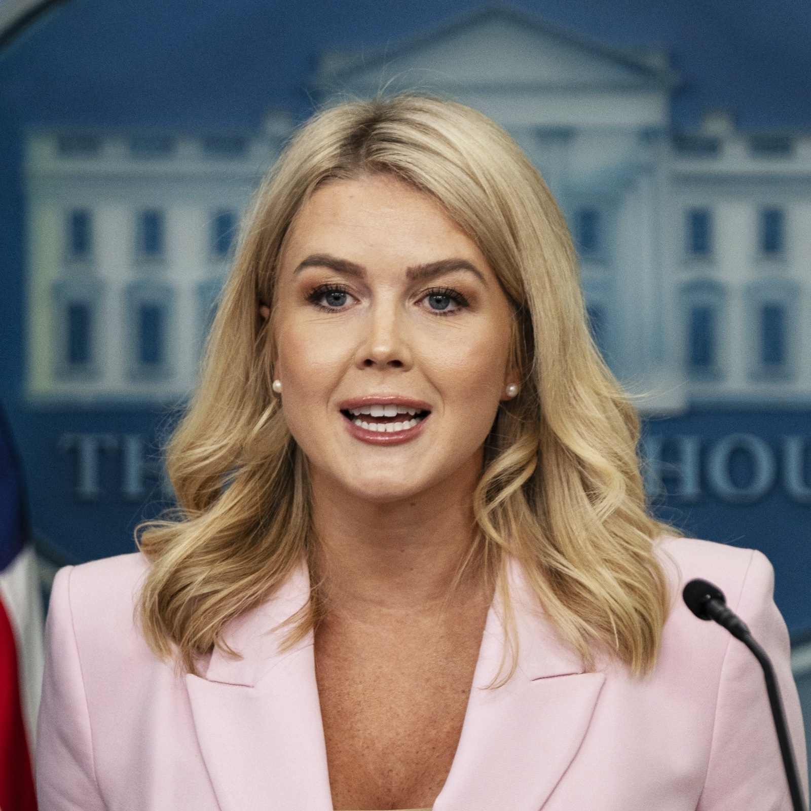 Karoline Leavitt speaks in front of a White House podium