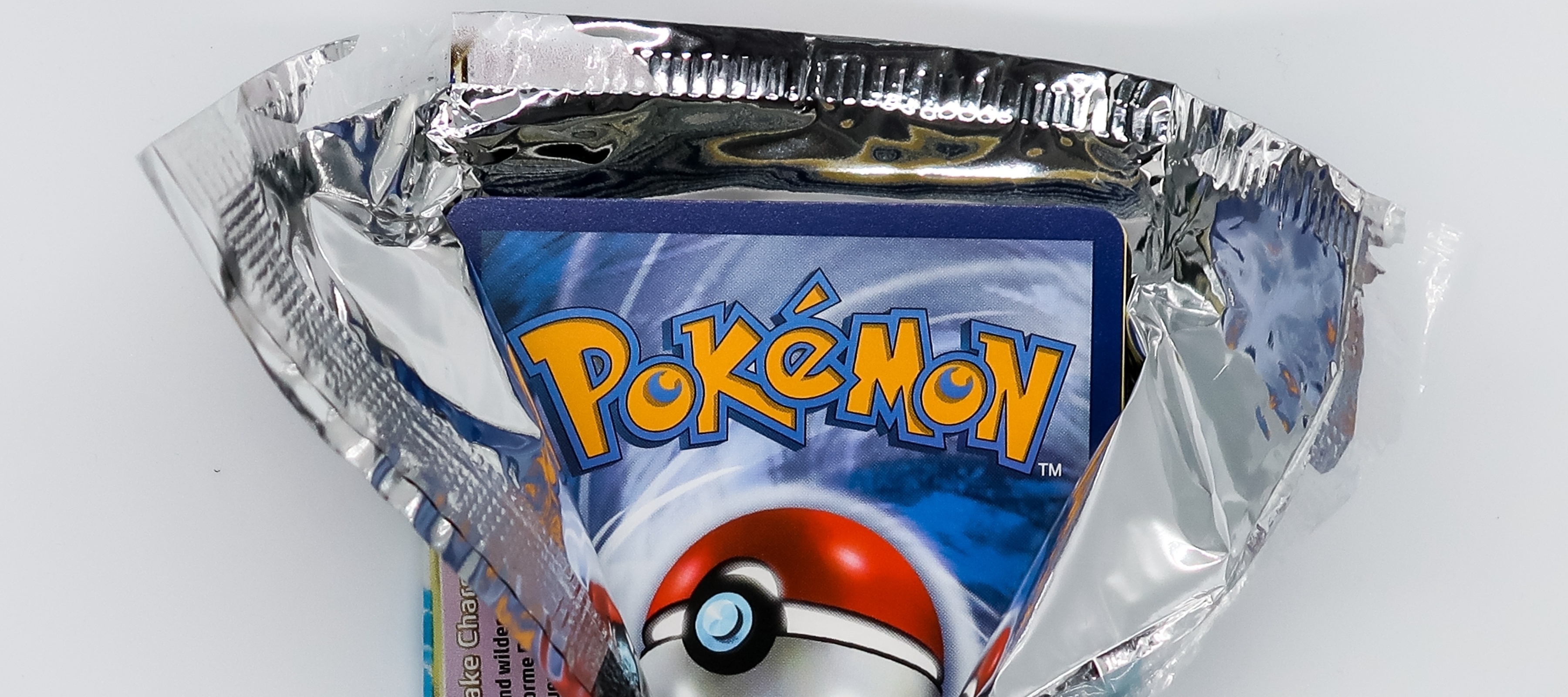 A pack of Pokémon cards being opened